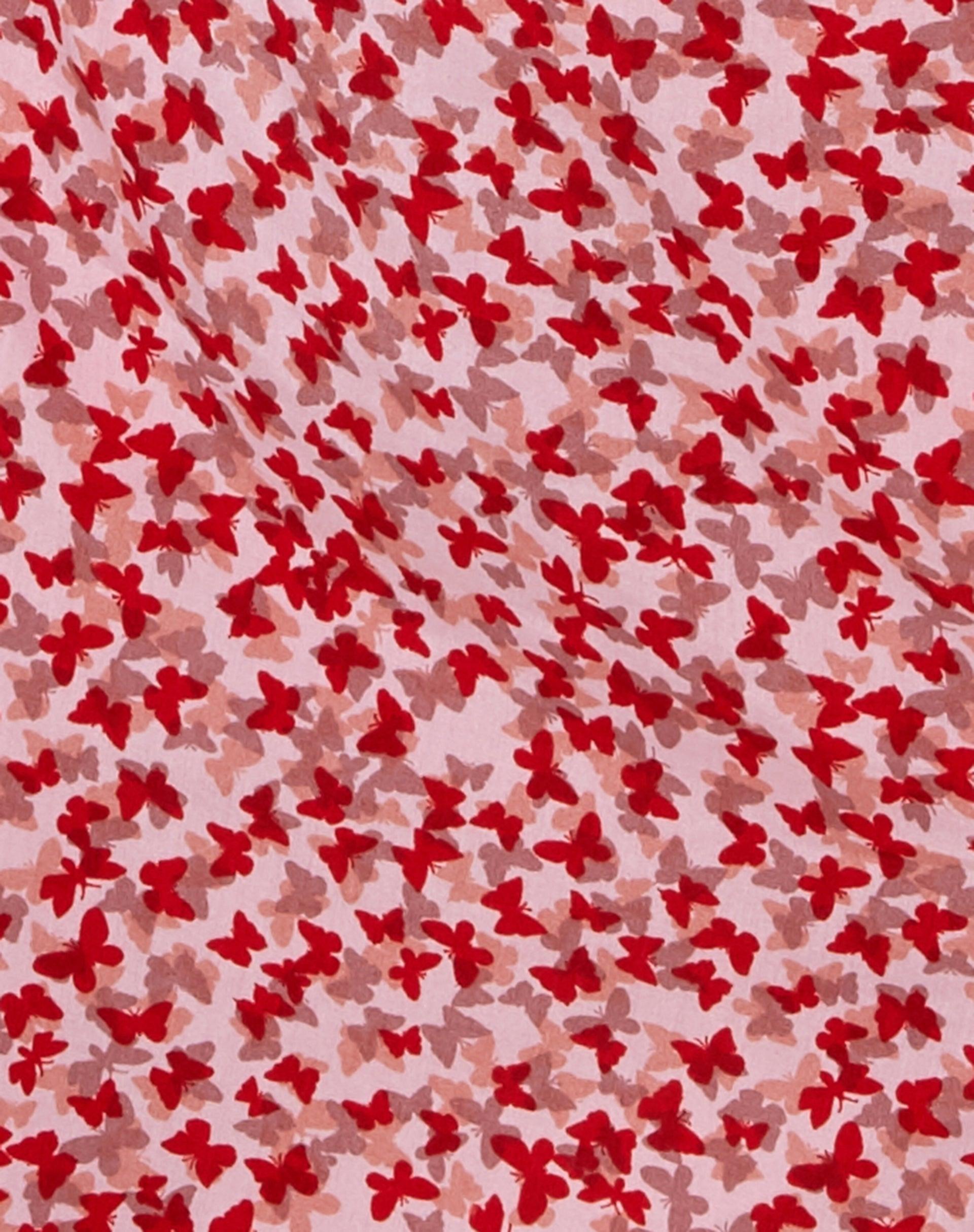 Sheny Mini Skirt in Ditsy Butterfly Peach and Red Product Image