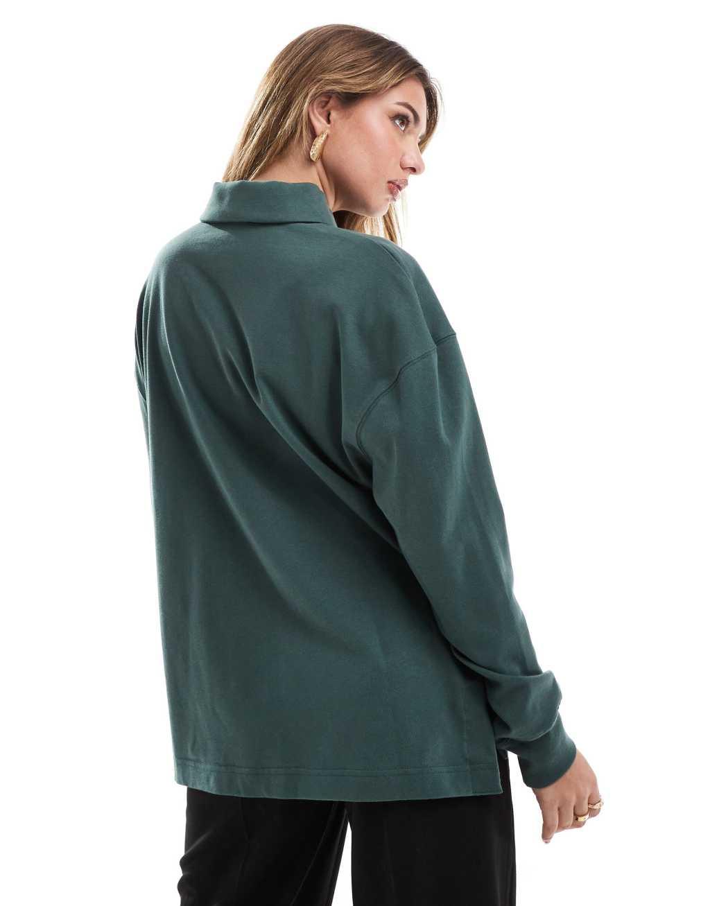Nike Essential oversized long sleeve polo in dark green Product Image