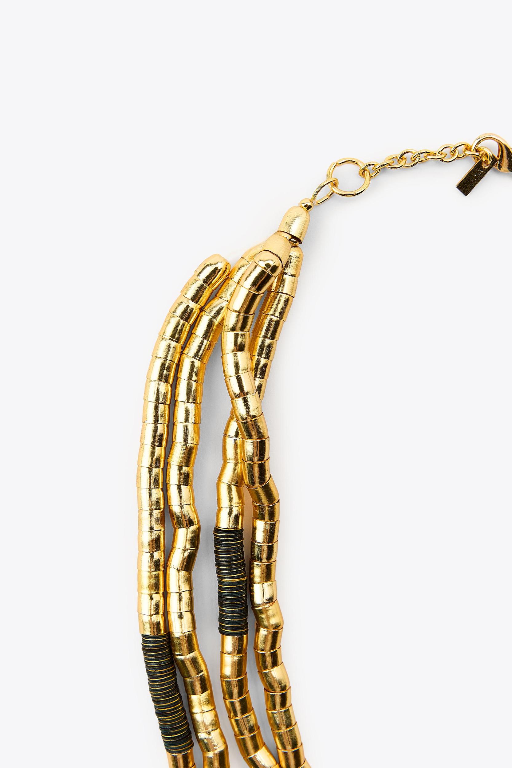 NECKLACE WITH MULTIPLE COMBINED PIECES Product Image