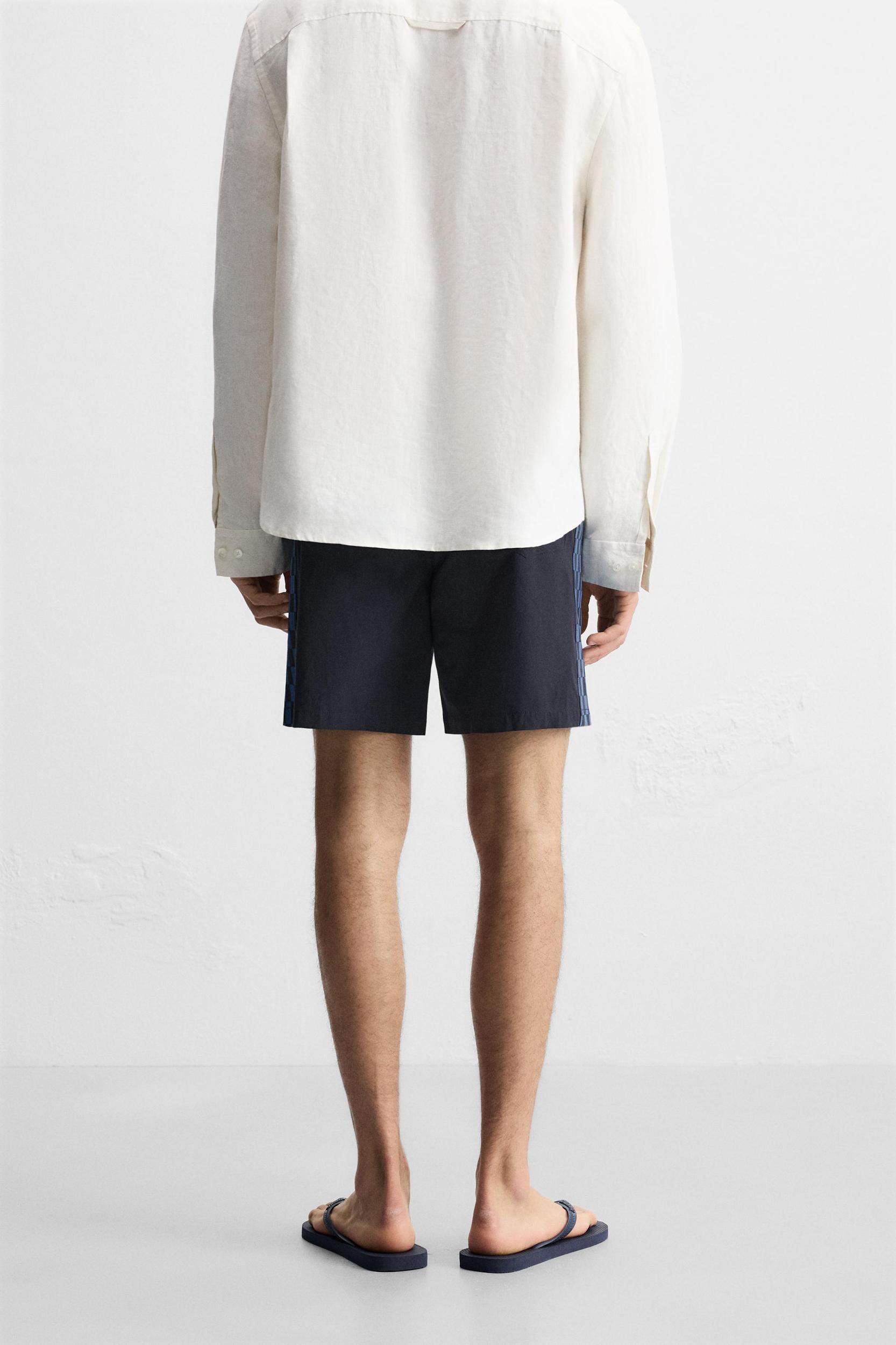 LONG CHECKERED BANDS SWIMSUIT Product Image