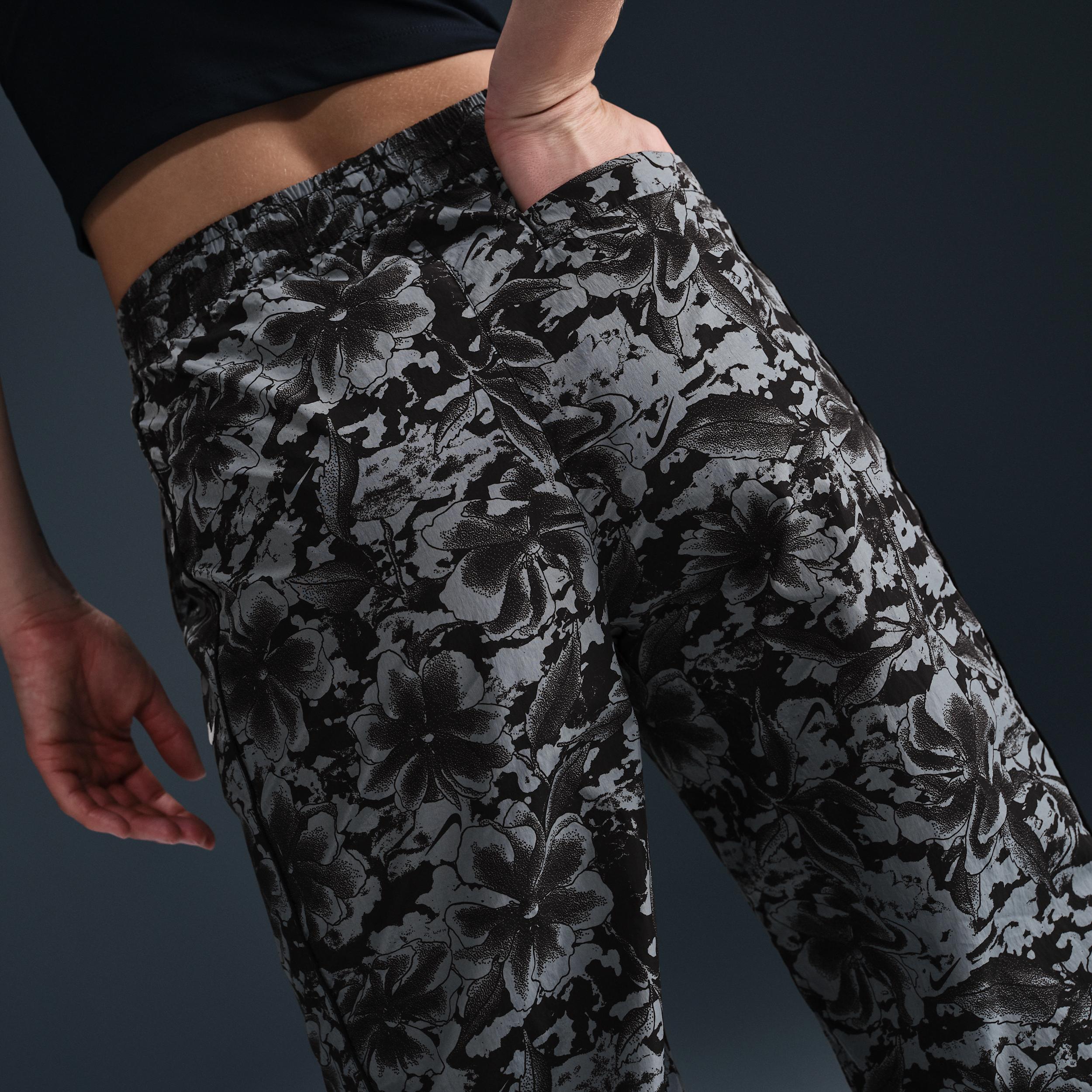 Nike Sportswear Windrunner Women's UV Protection Mid-Rise Woven Printed Pants Product Image