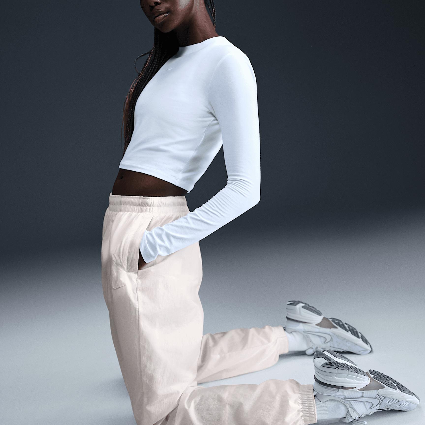 Womens Nike Sportswear Essential Mid-Rise Oversized Woven Jogger Pants | FV7668-004 Product Image