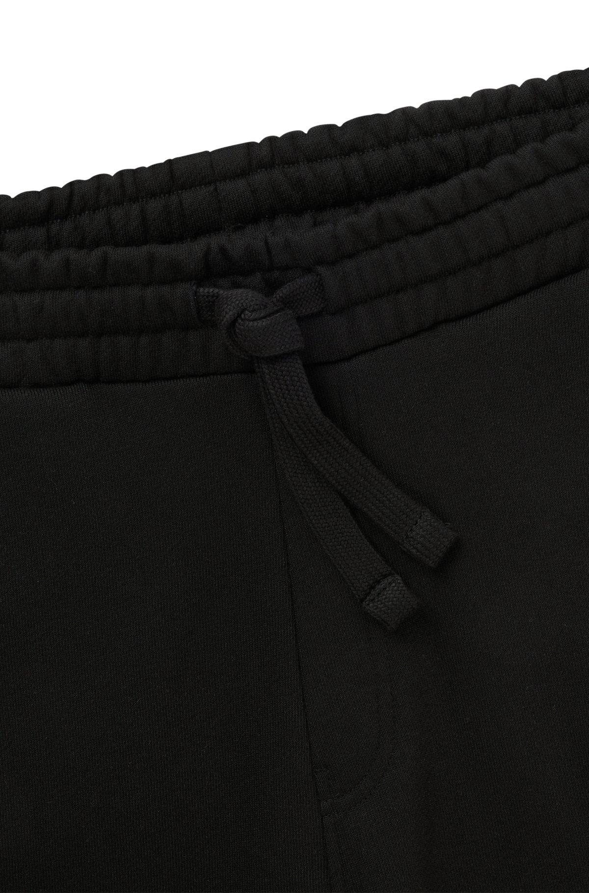 Cotton-terry tracksuit bottoms with embroidered graphics Product Image