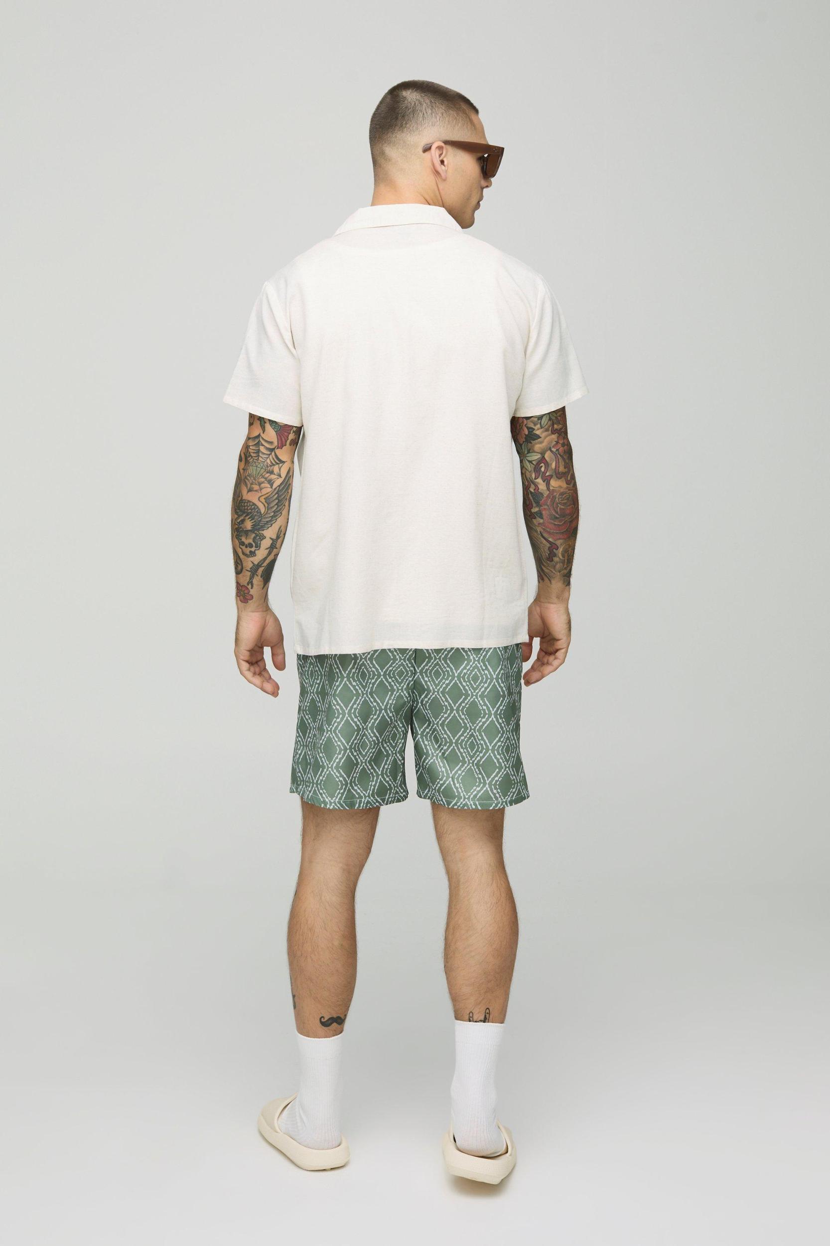 Abstract Pattern Mid Length Swim Trunks | boohooMAN USA Product Image