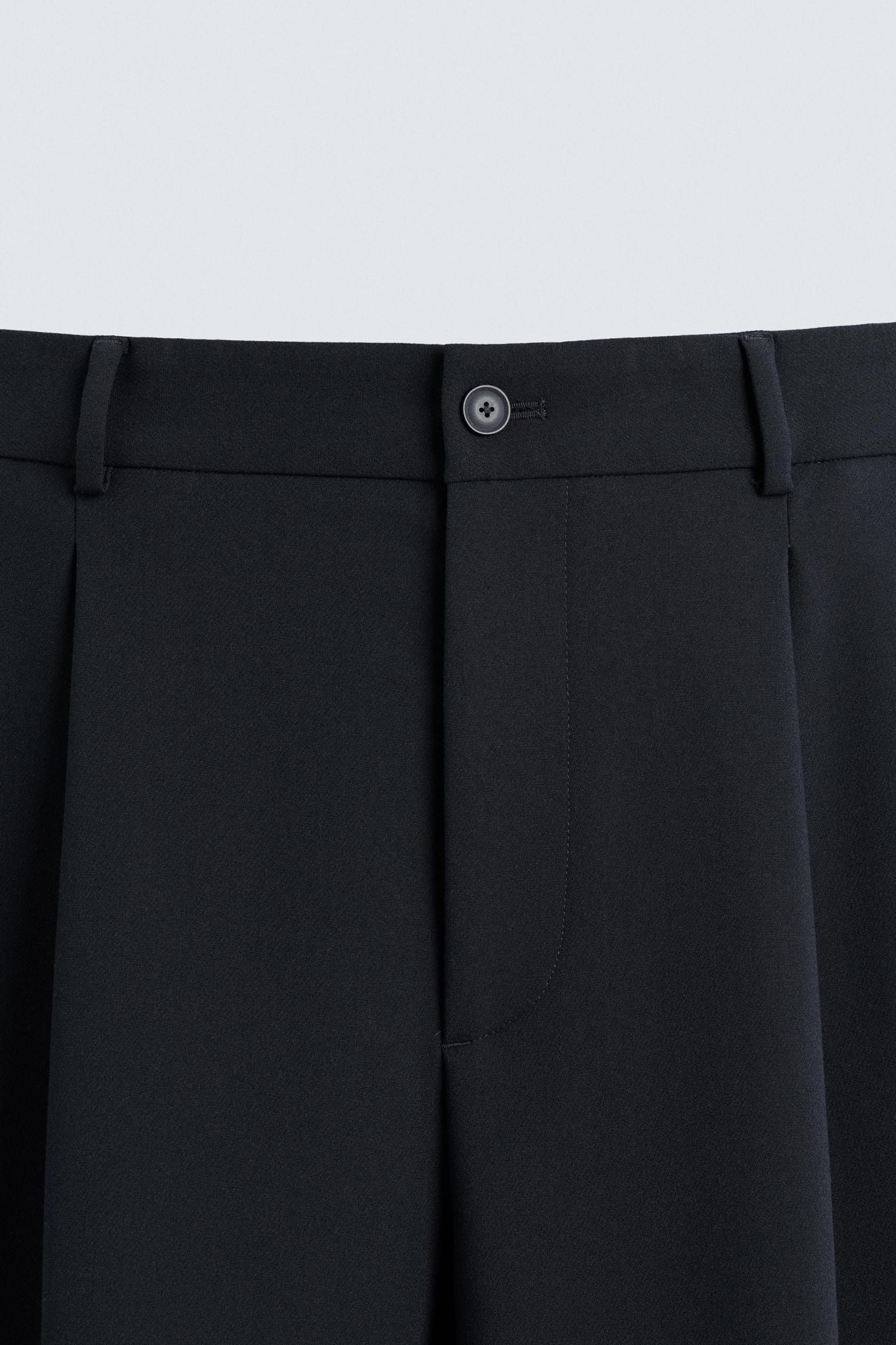 RELAXED FIT PLEATED PANTS Product Image