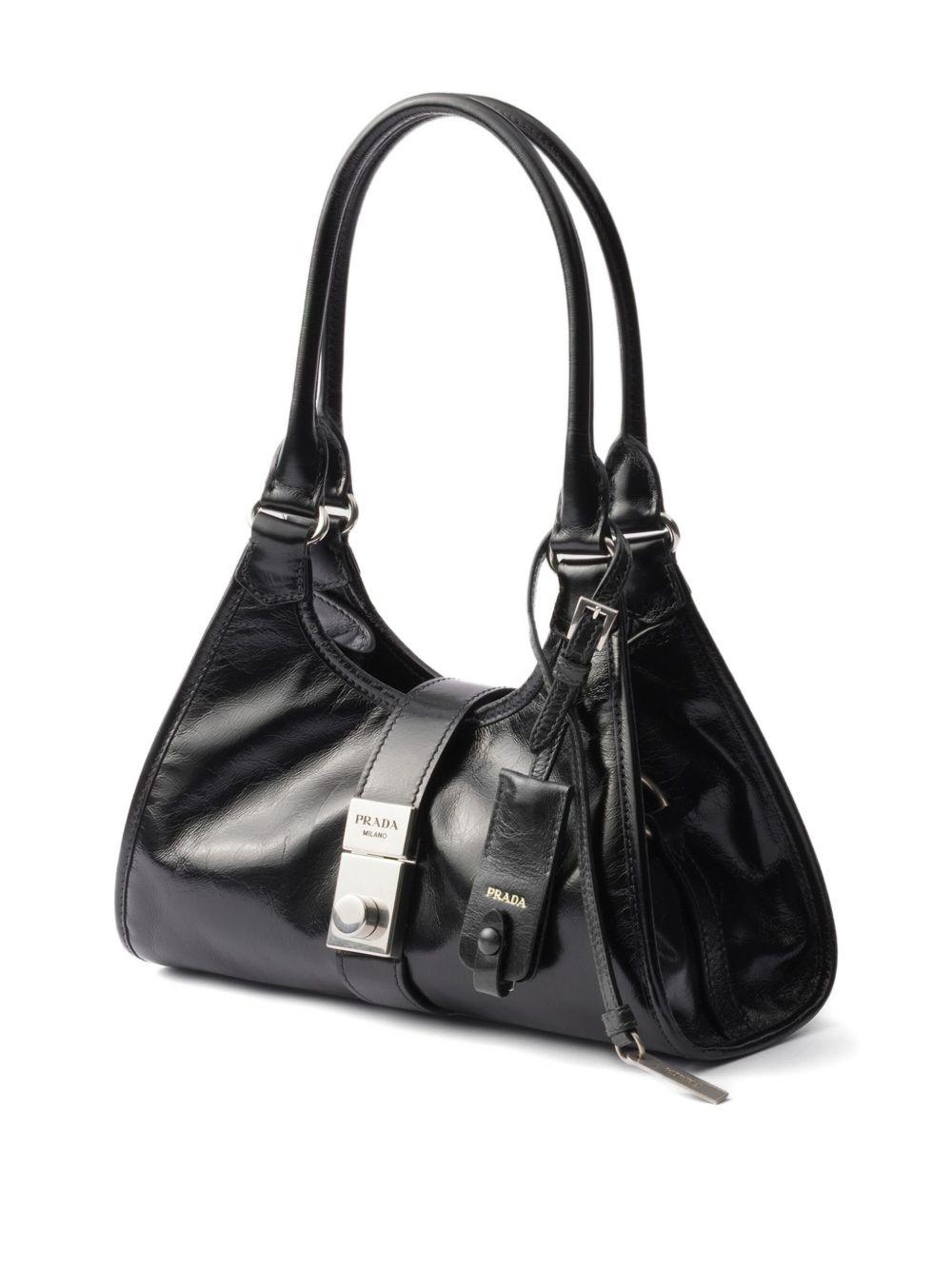 small push-lock leather tote bag Product Image