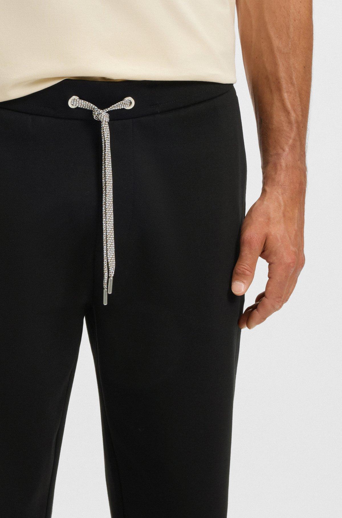 Tracksuit bottoms with patterned drawcord Product Image