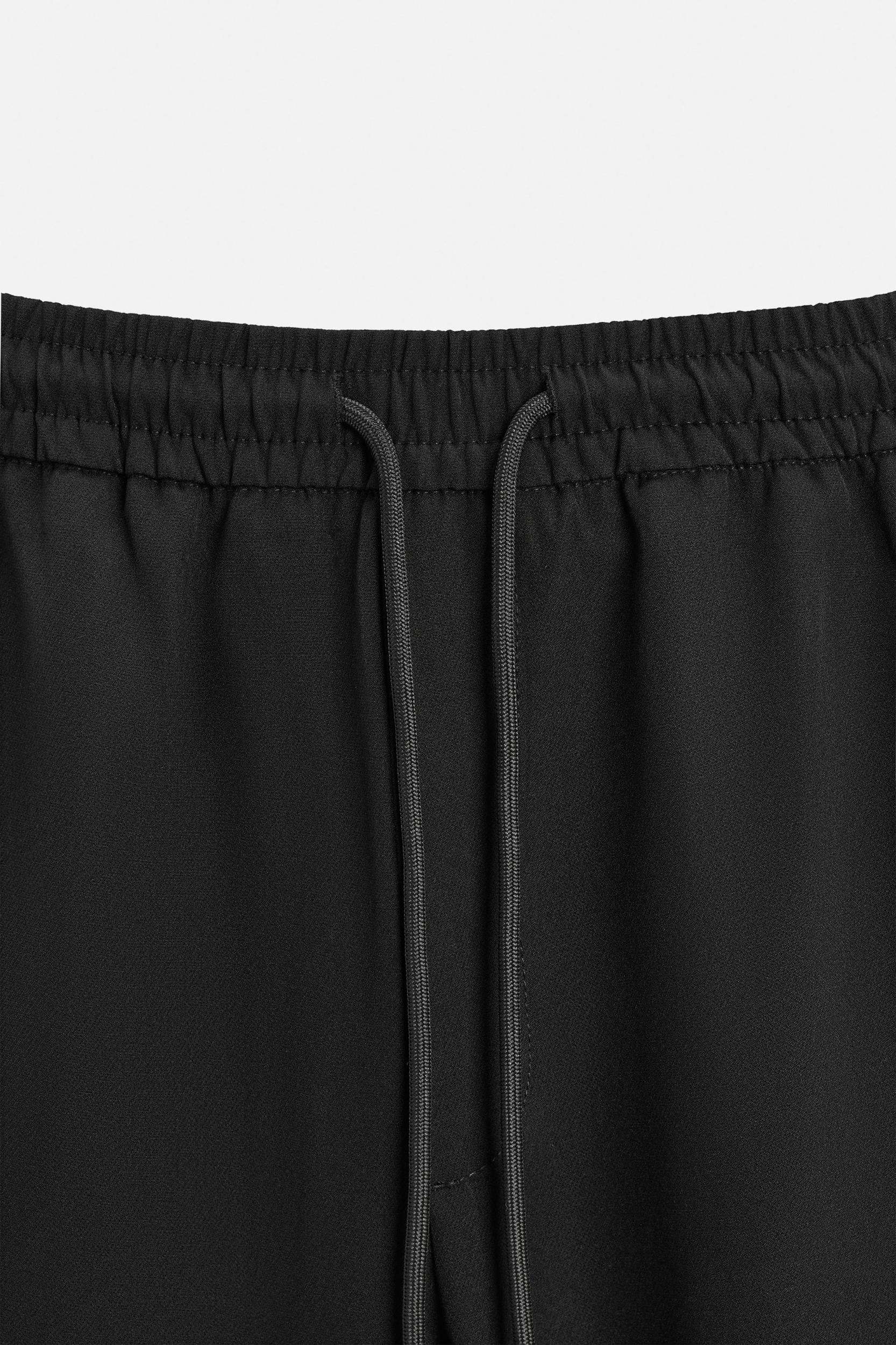 TECHNICAL PANTS WITH BANDS Product Image