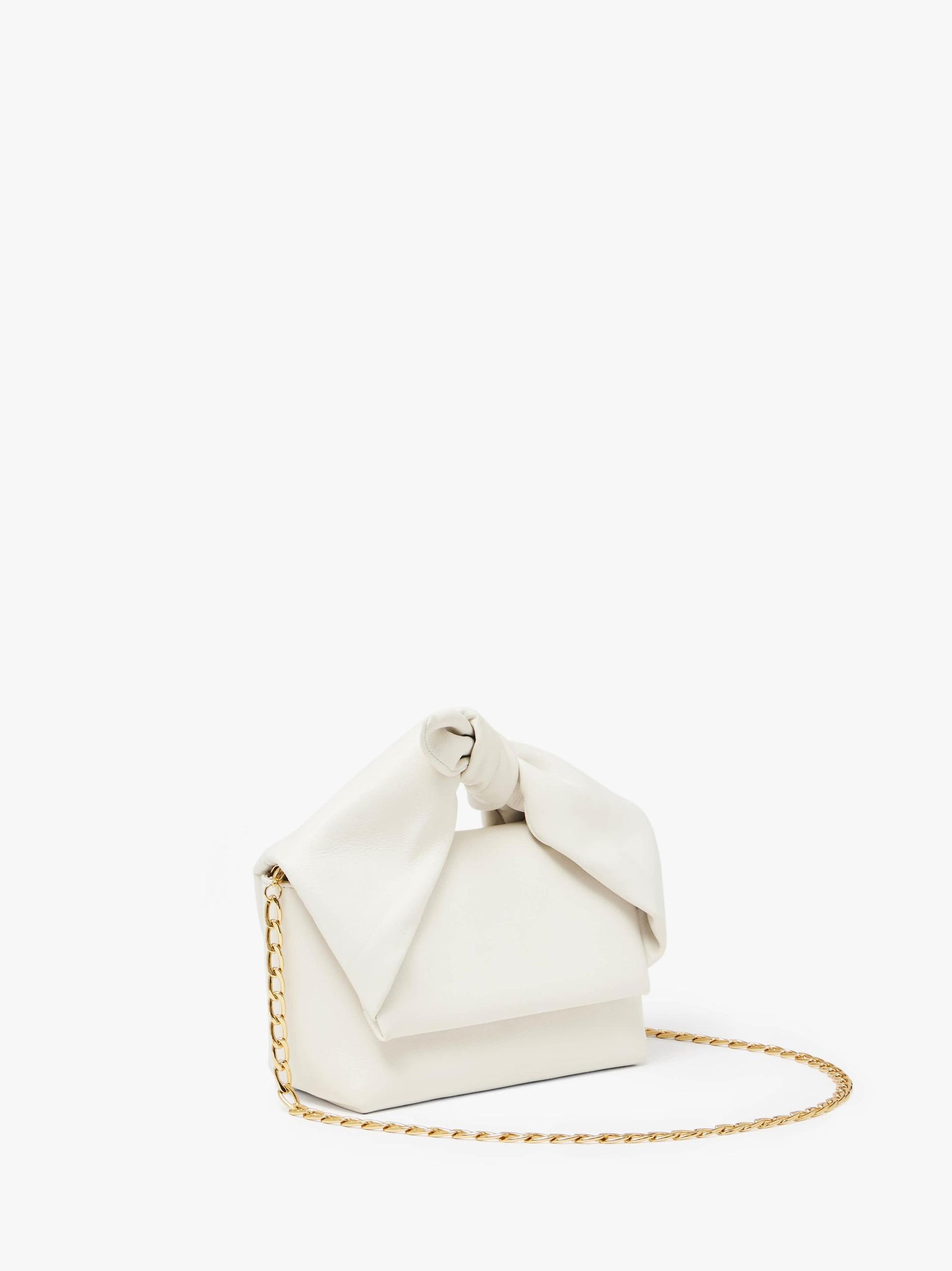 MEDIUM BOW TWISTER - LEATHER TOP HANDLE BAG Product Image