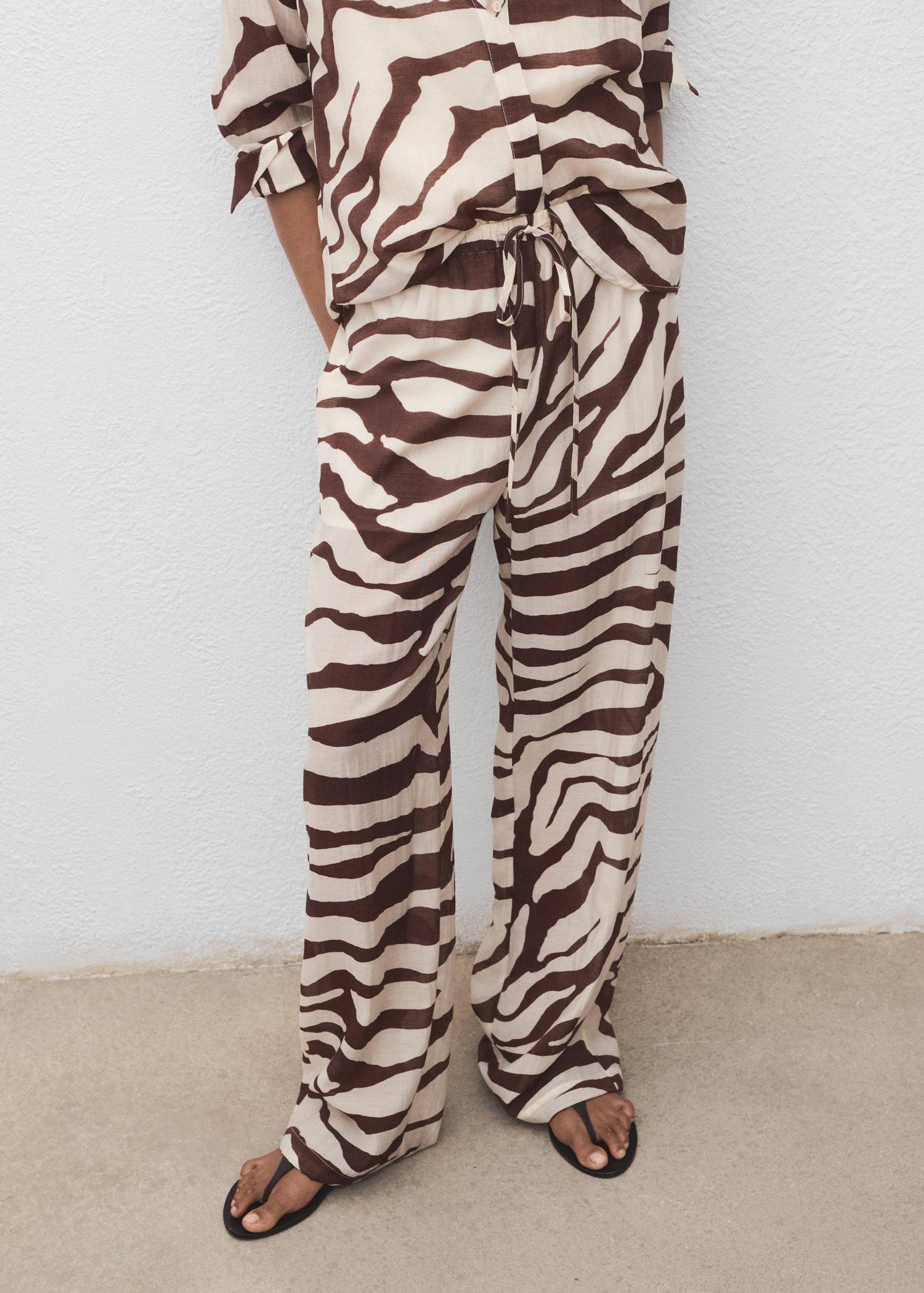 Zebra-print fluid pants - Women | MANGO USA Product Image