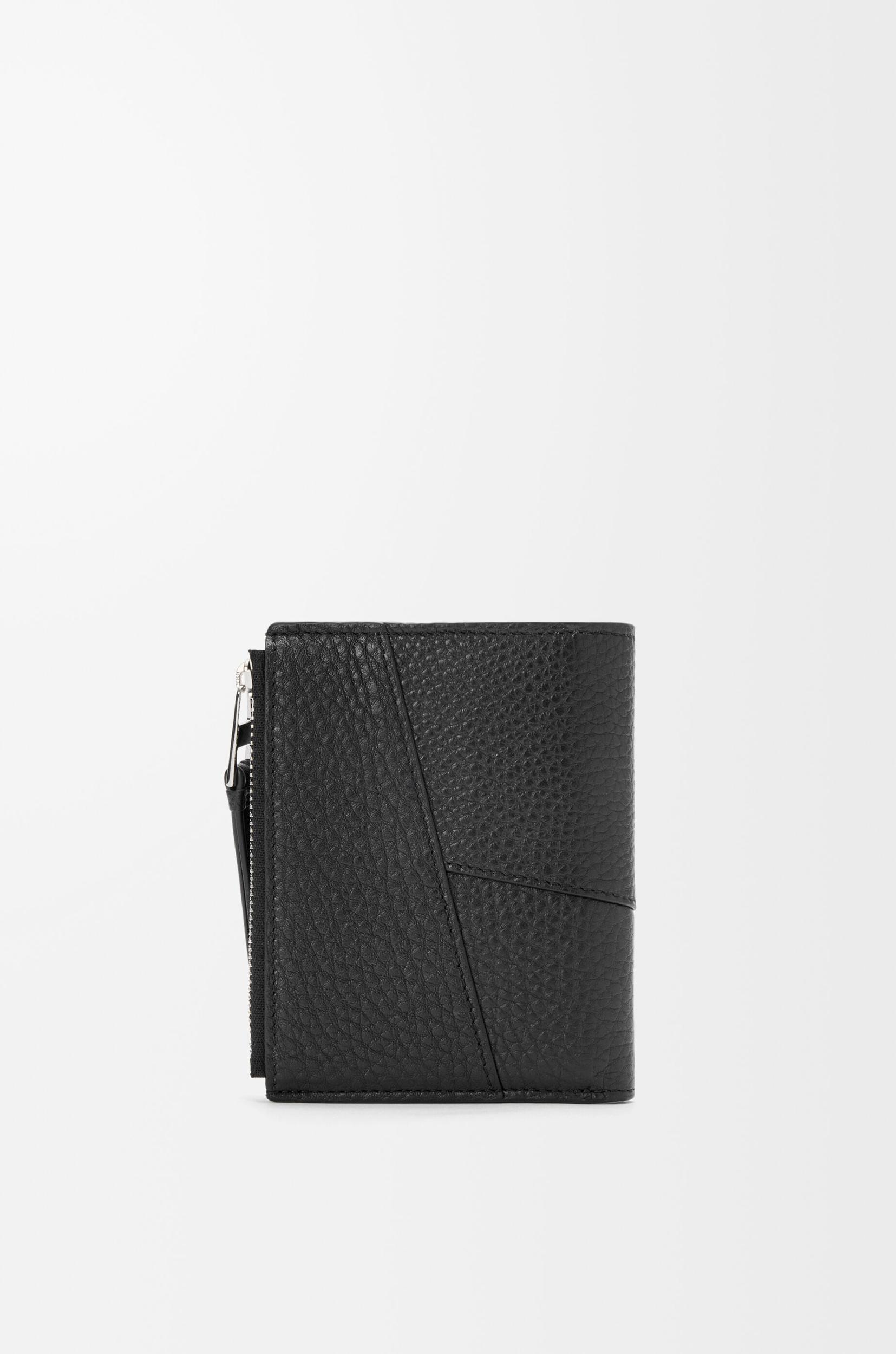 Puzzle slim compact wallet in supple grained calfskin Product Image