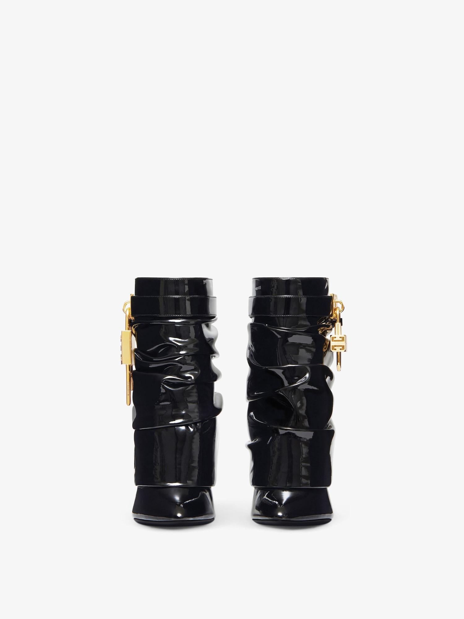 Shark Lock Stiletto ankle boots in latex Product Image