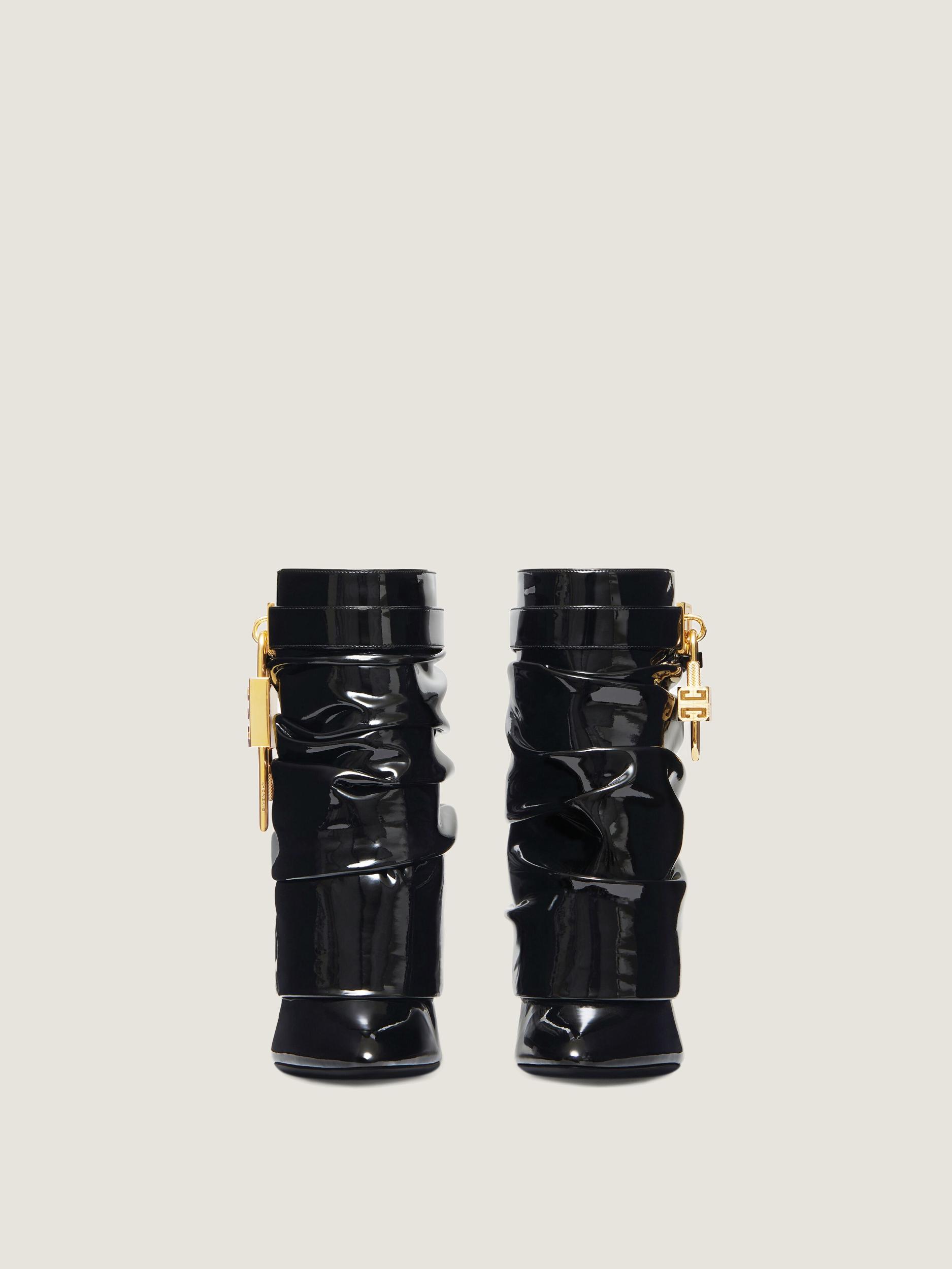 Shark Lock Stiletto ankle boots in latex Product Image