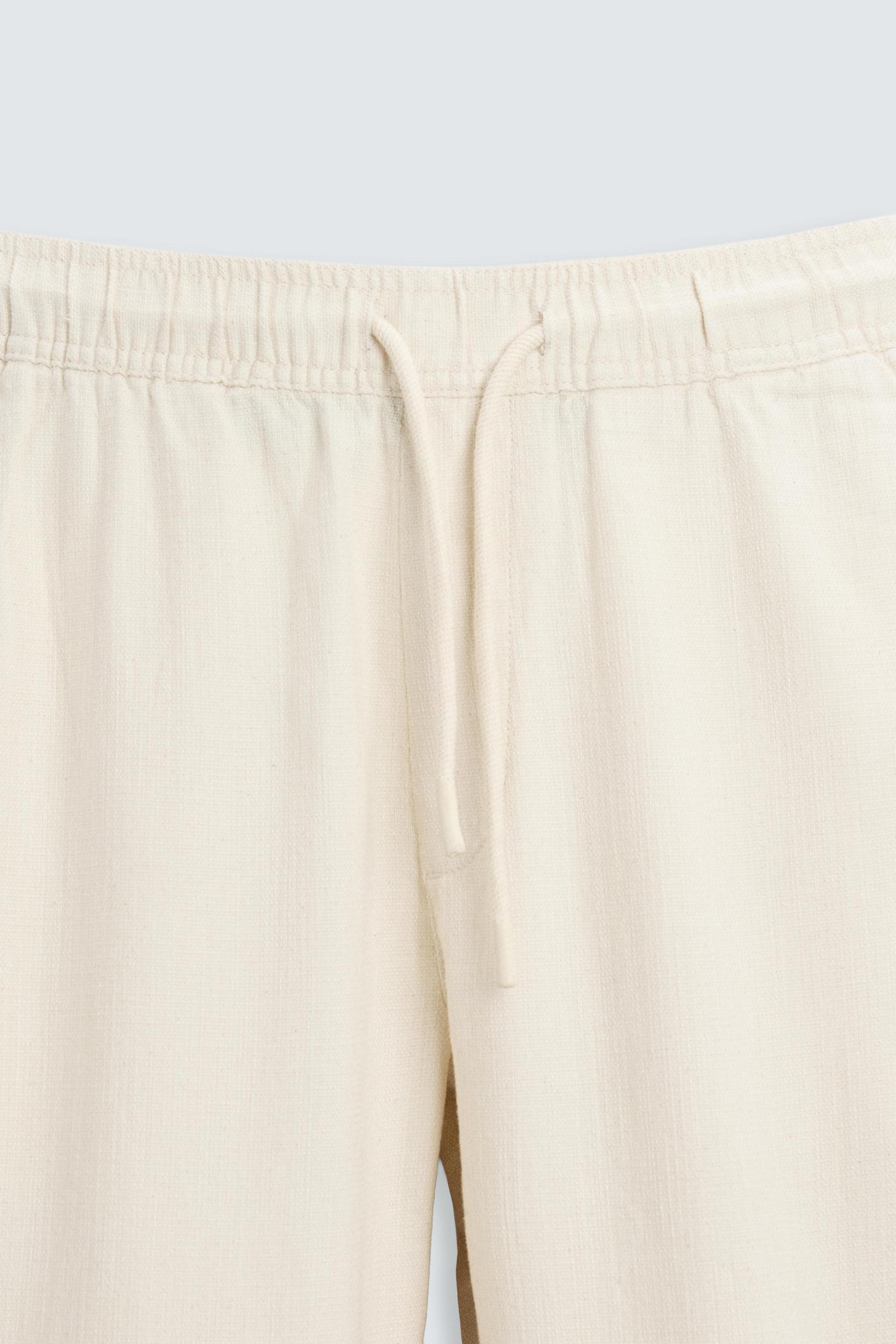 TEXTURED RELAXED FIT PANTS Product Image