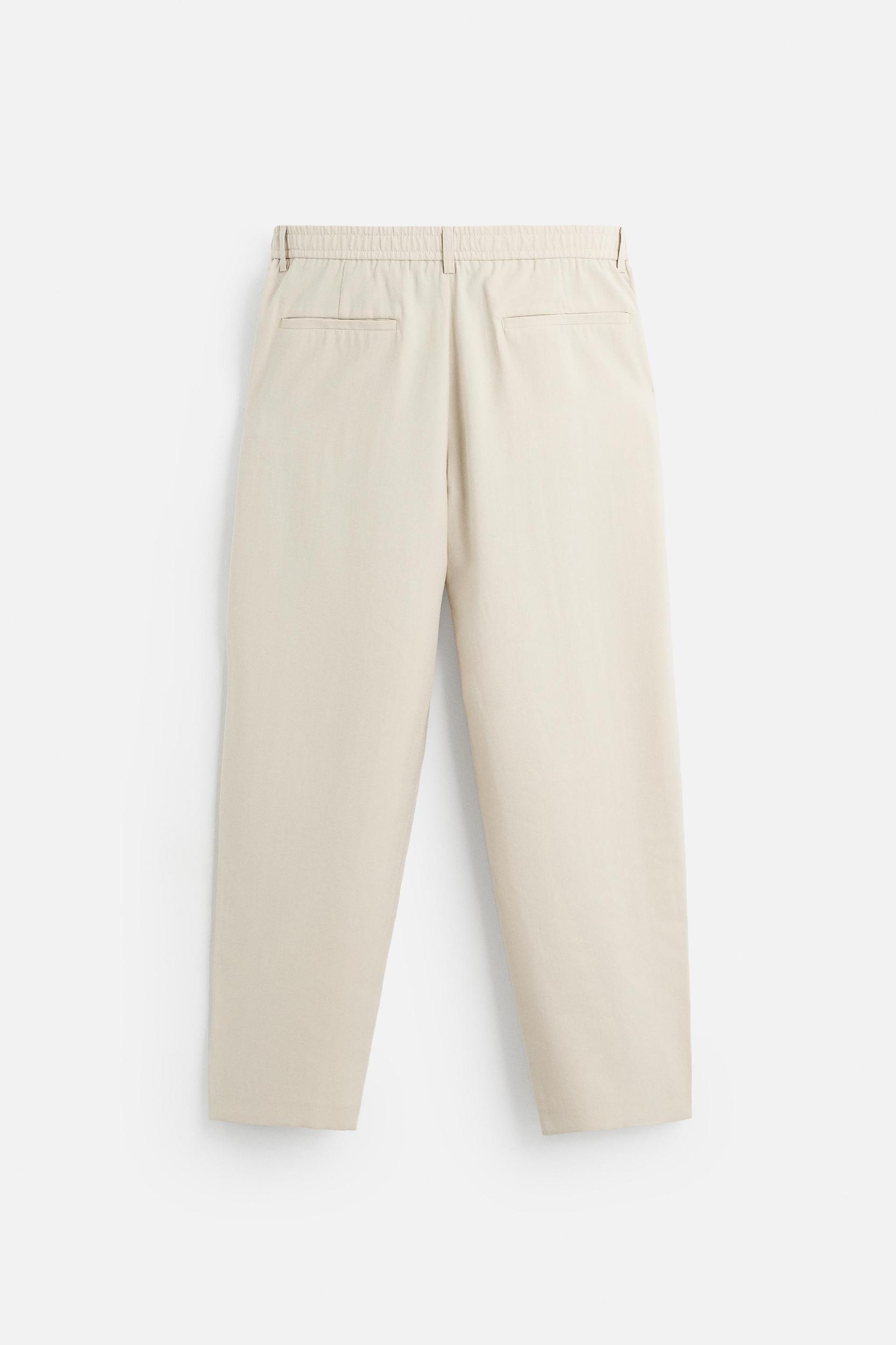FLOWY PLEATED PANTS Product Image