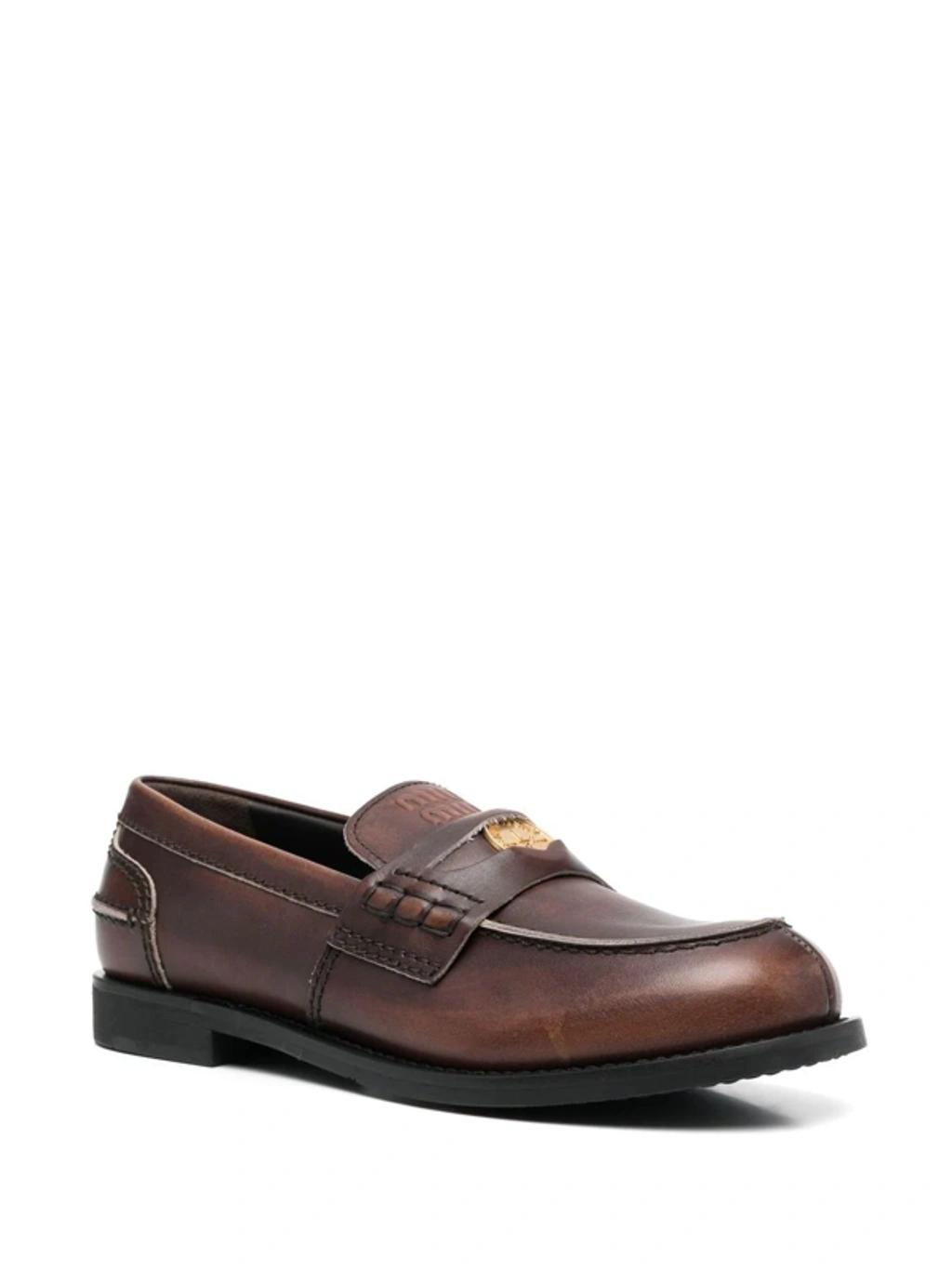 MIU MIU Leather Distressed Penny Loafers In Brown Product Image