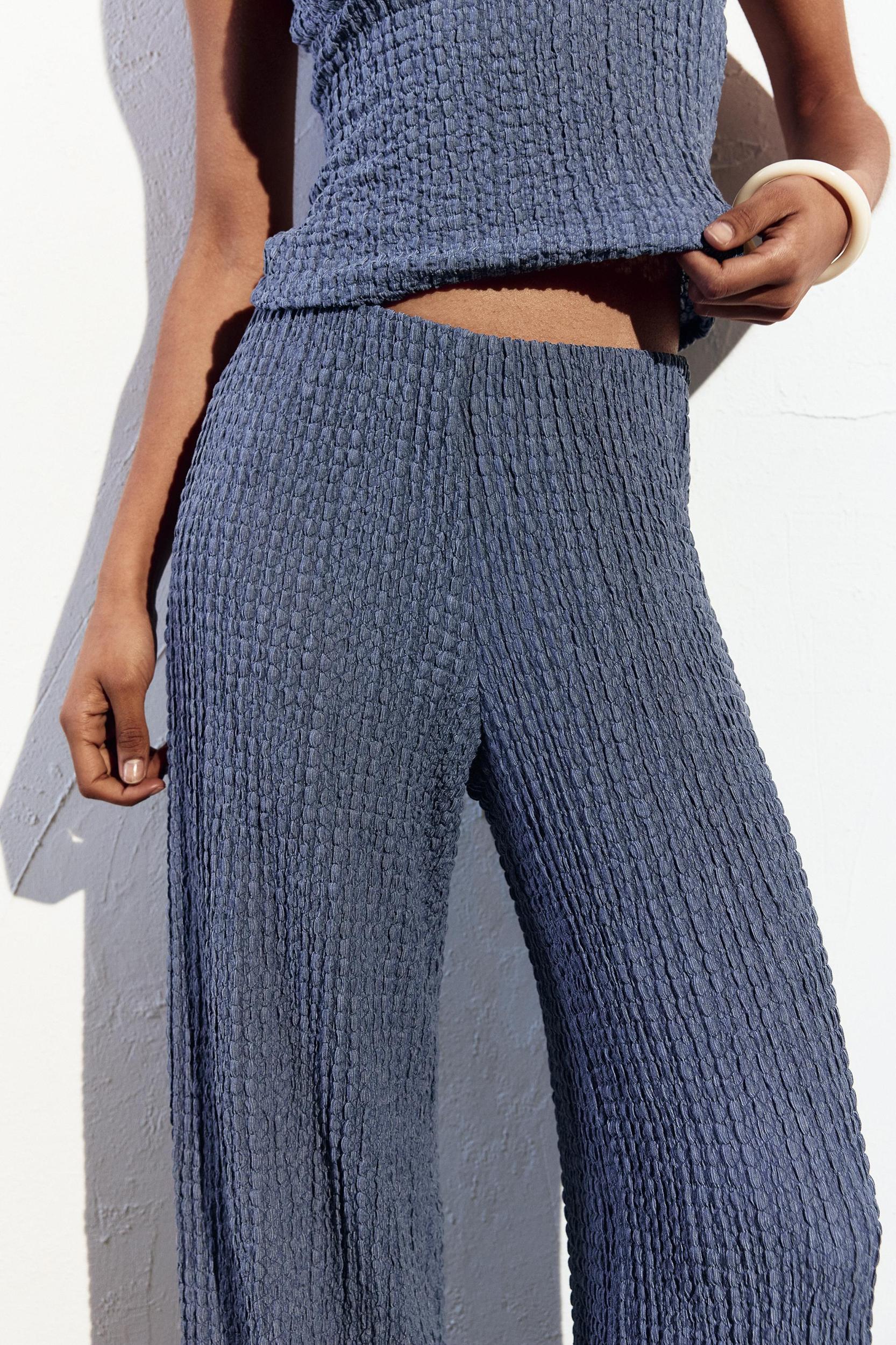 Rustic creased-effect pants Product Image