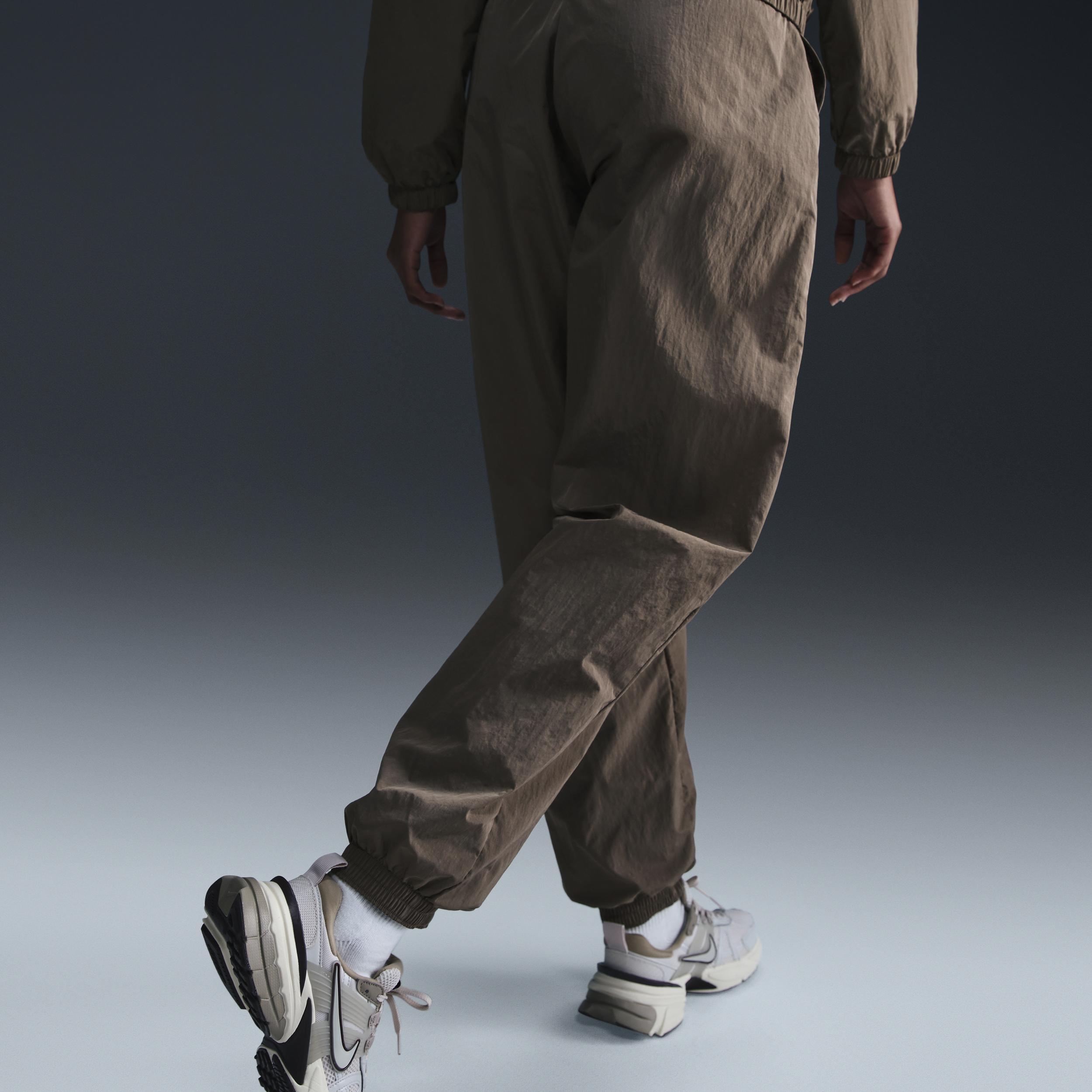 Womens Nike Sportswear Essential Mid-Rise Oversized Woven Jogger Pants | FV7668-004 Product Image