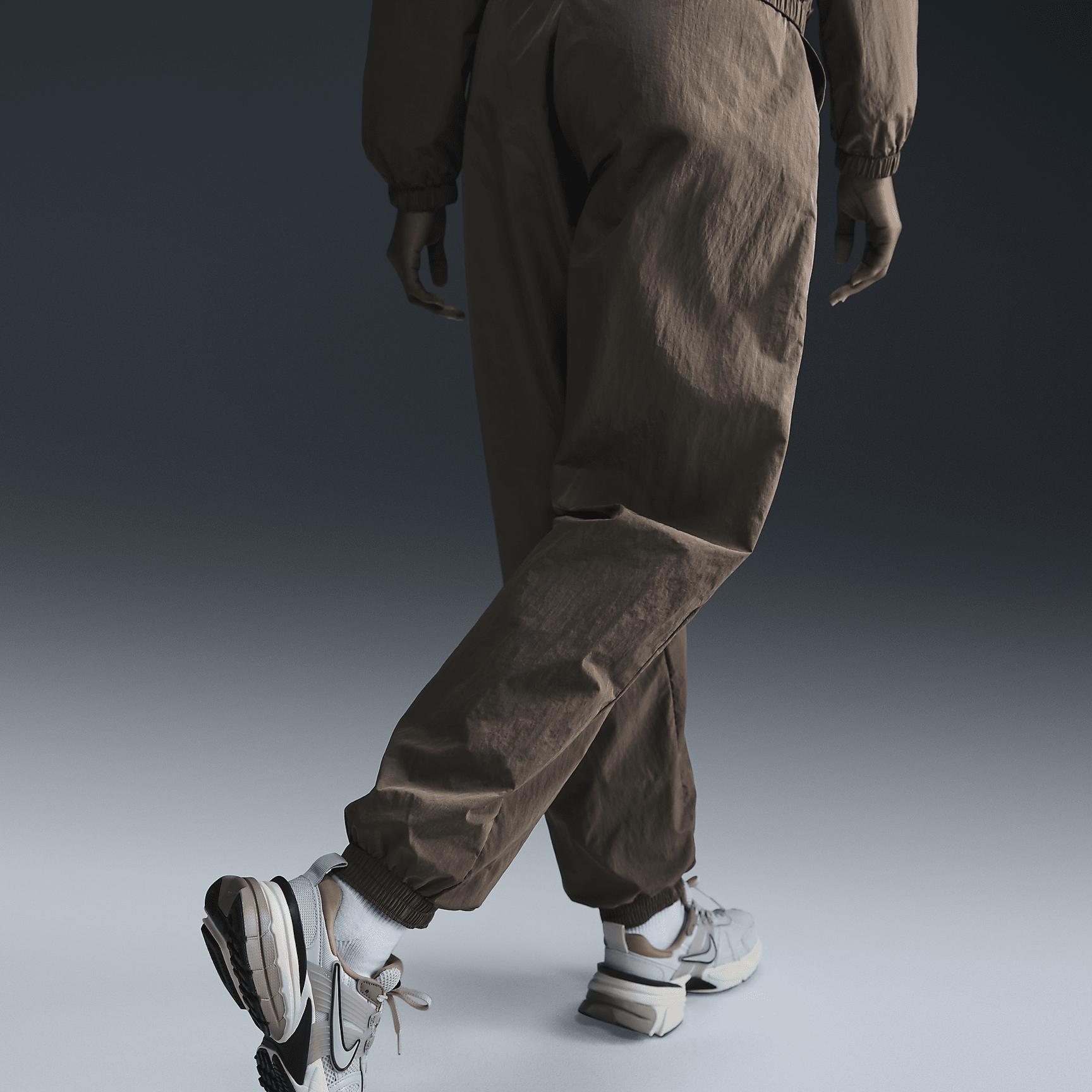 Womens Nike Sportswear Essential Mid-Rise Oversized Woven Jogger Pants | FV7668-004 Product Image