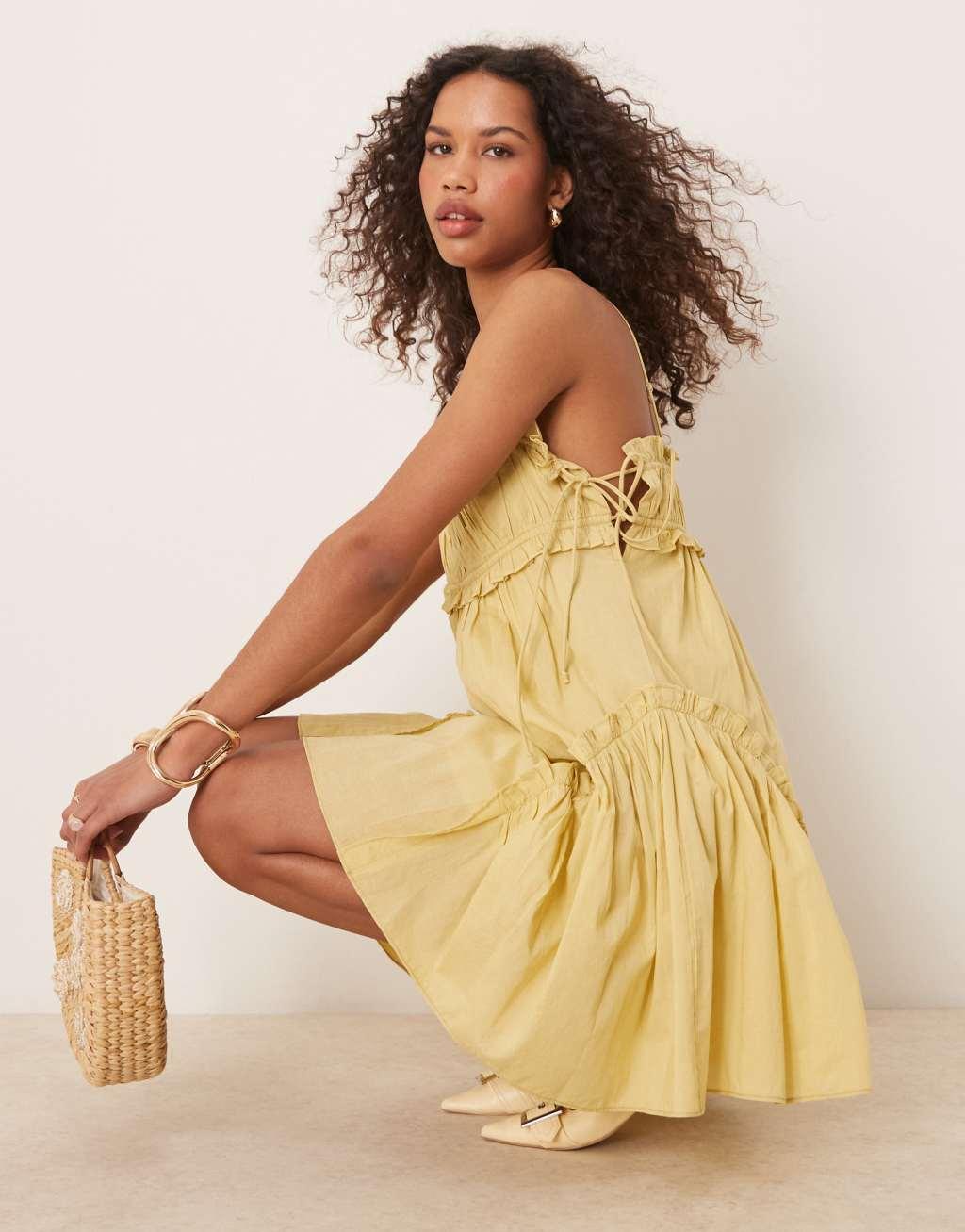 ASOS DESIGN babydoll mini dress with ruffle hem in washed lime Product Image