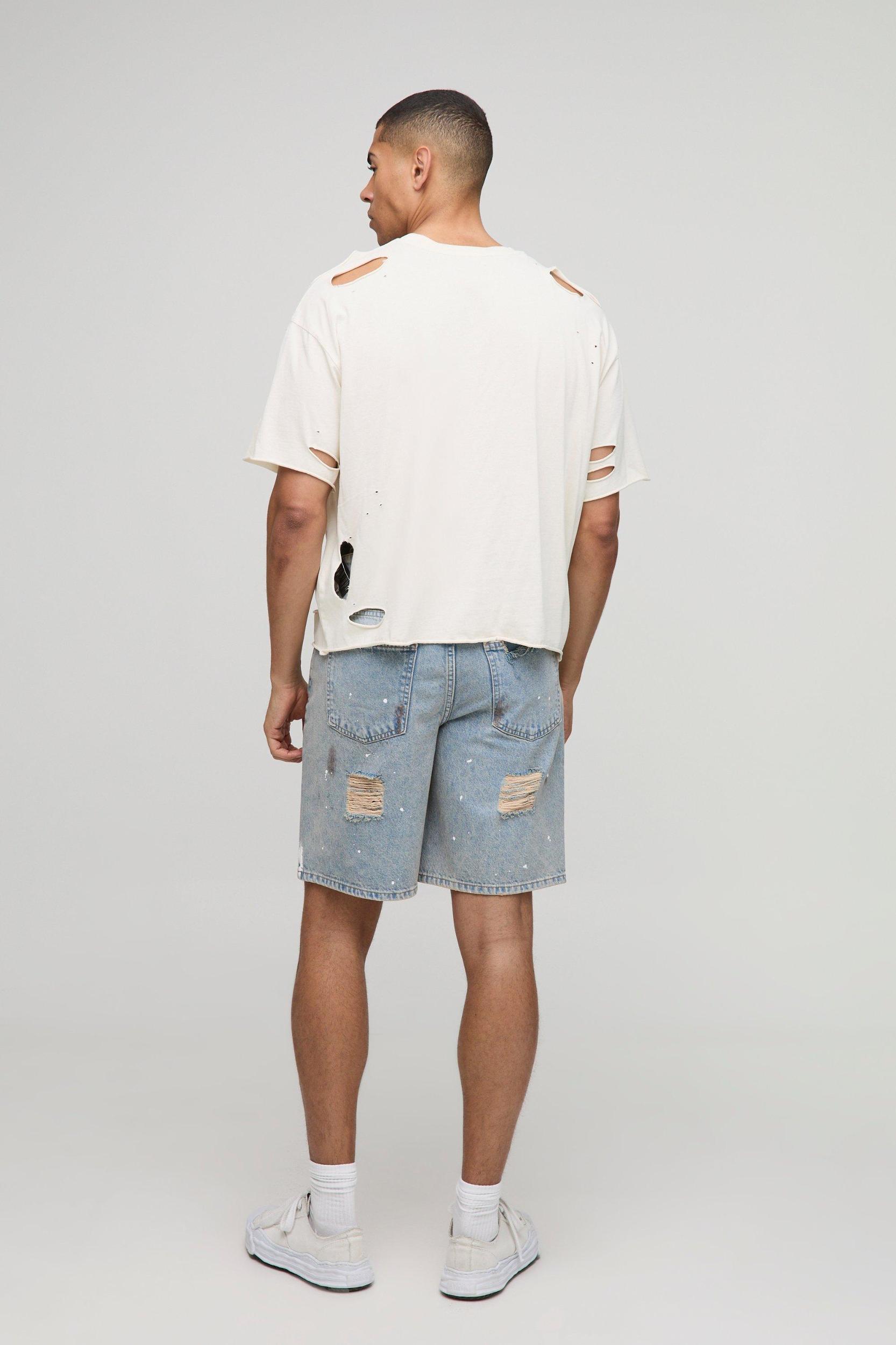 Relaxed Ripped Paint Splatter Rigid Denim Shorts In Light Blue | boohooMAN USA Product Image