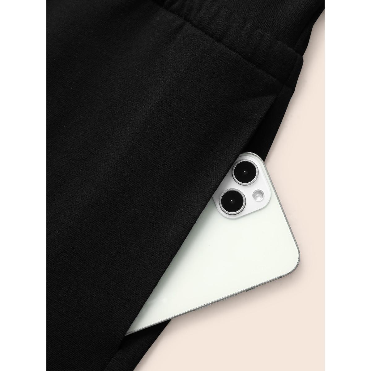 Plus Size Black Solid Overlap Collar Drawstring Jumpsuit Women Elegant Sleeveless Overlap Collar Everyday Loose Jumpsuits BloomChic 14-16/1X Product Image