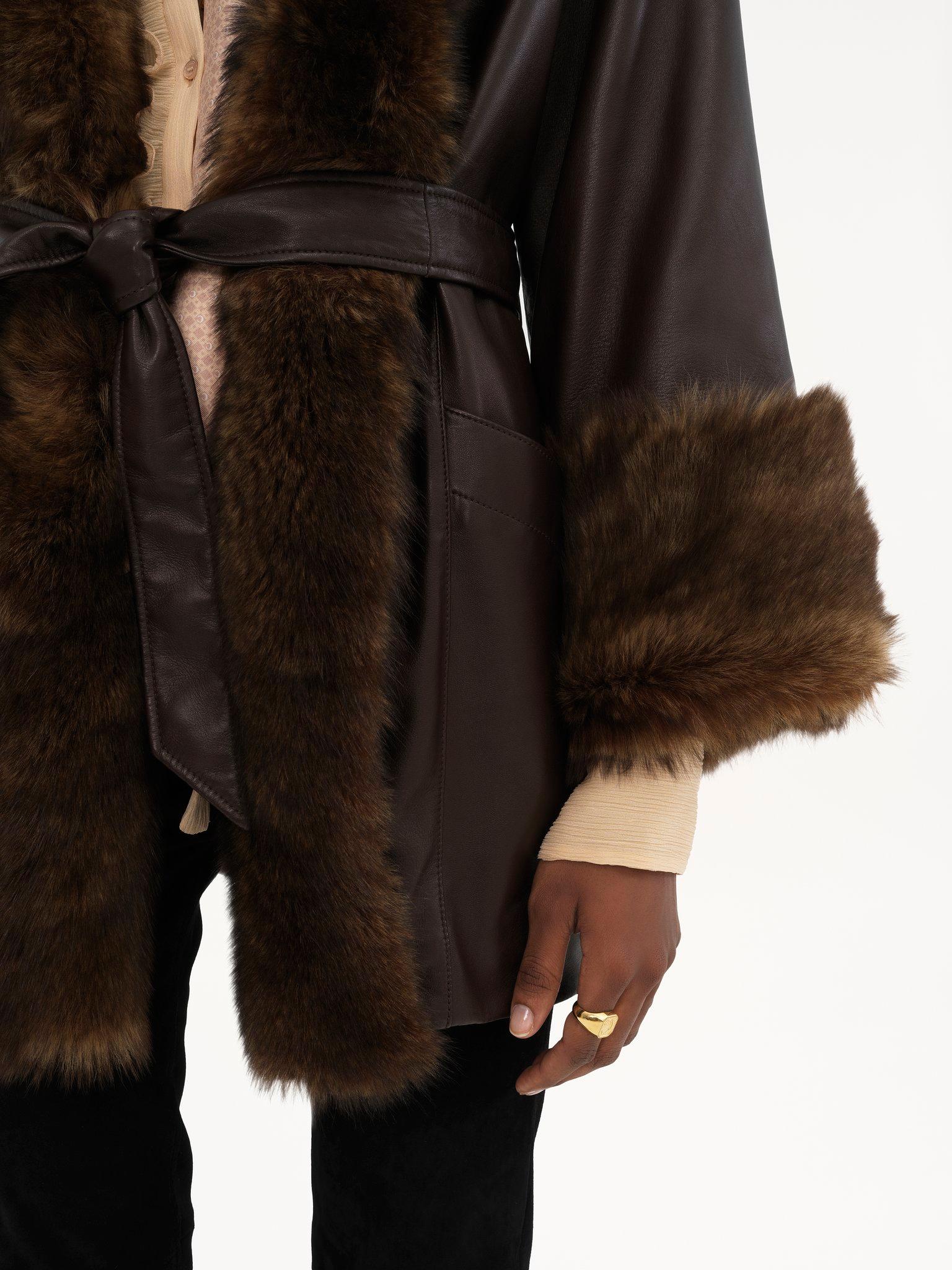 Belted oversized coat in leather Product Image