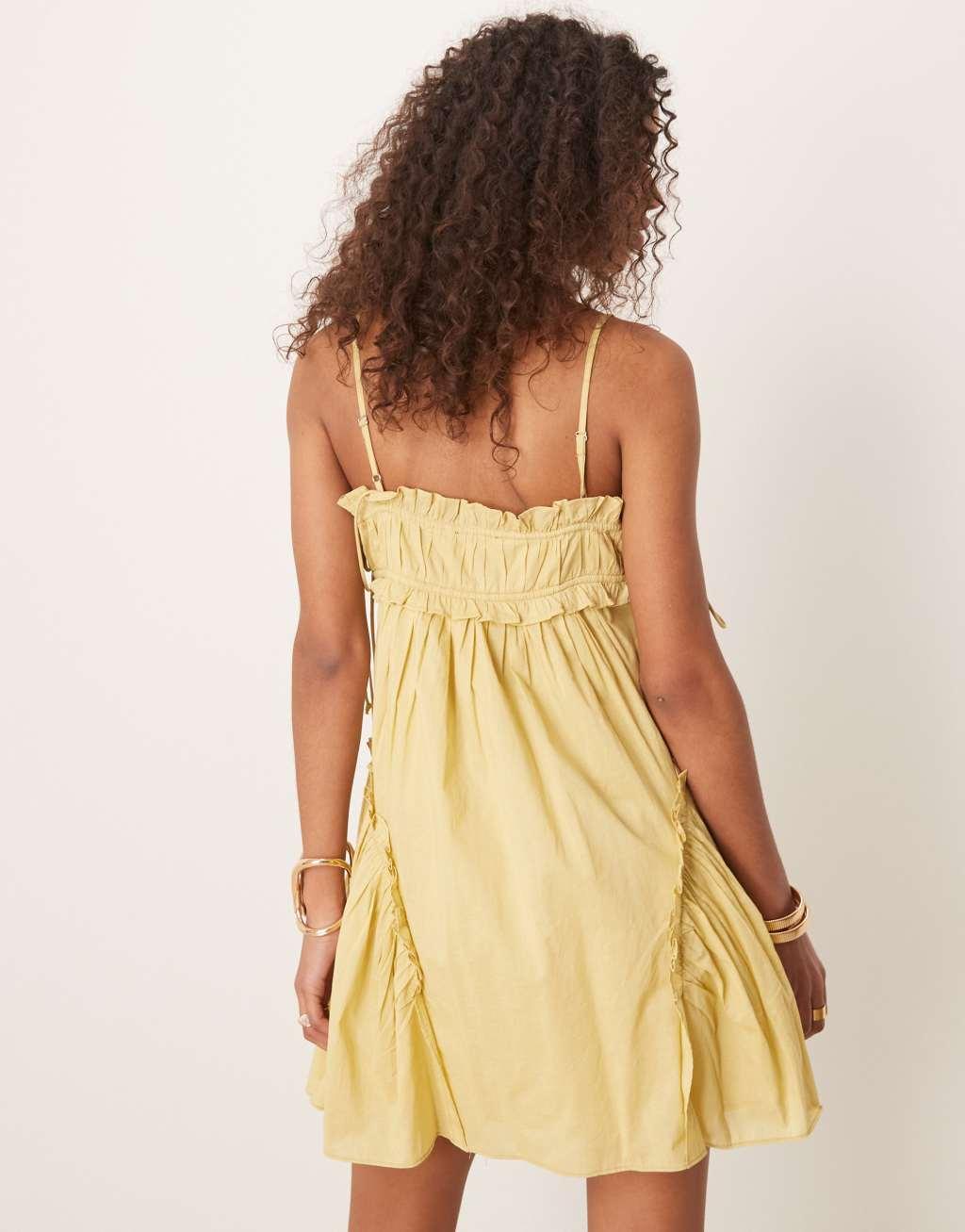 ASOS DESIGN babydoll mini dress with ruffle hem in washed lime Product Image