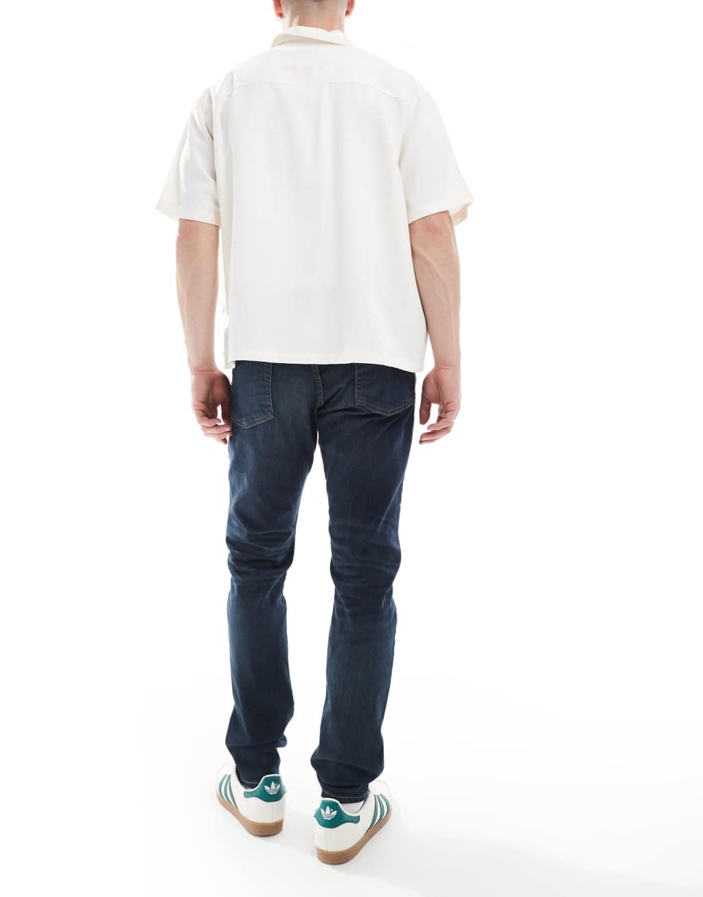 Polo Ralph Lauren Parkside icon logo back pocket low straight fit jeans in dark wash Product Image