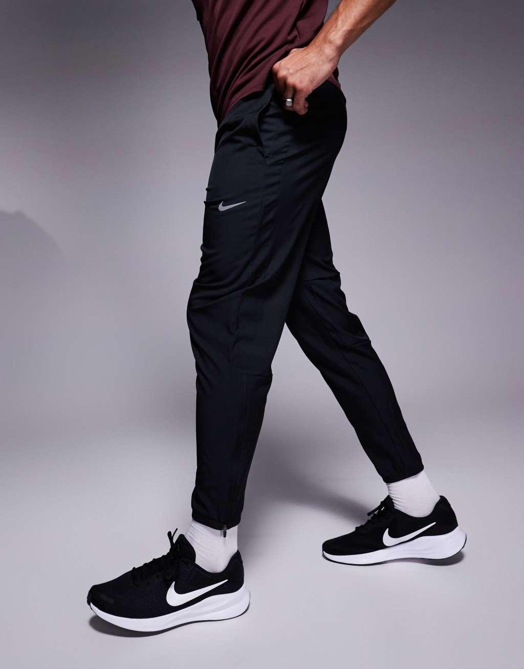 Nike Running Challenger woven sweatpants in black Product Image