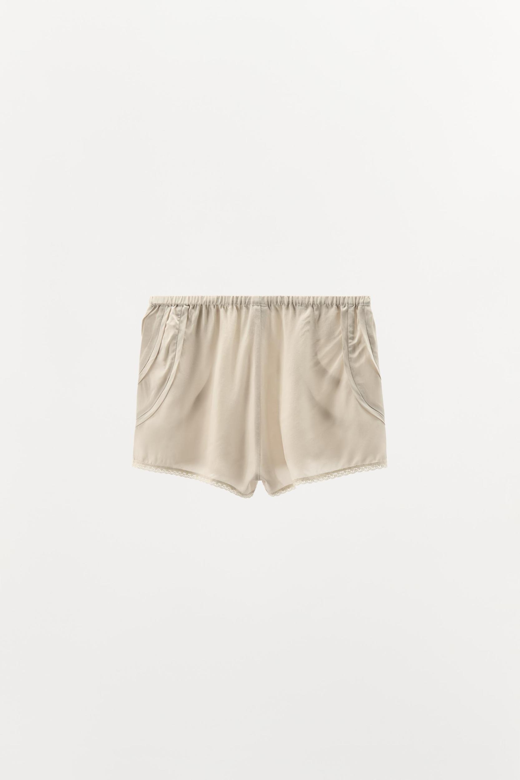 PLEATED LACE SHORTS Product Image