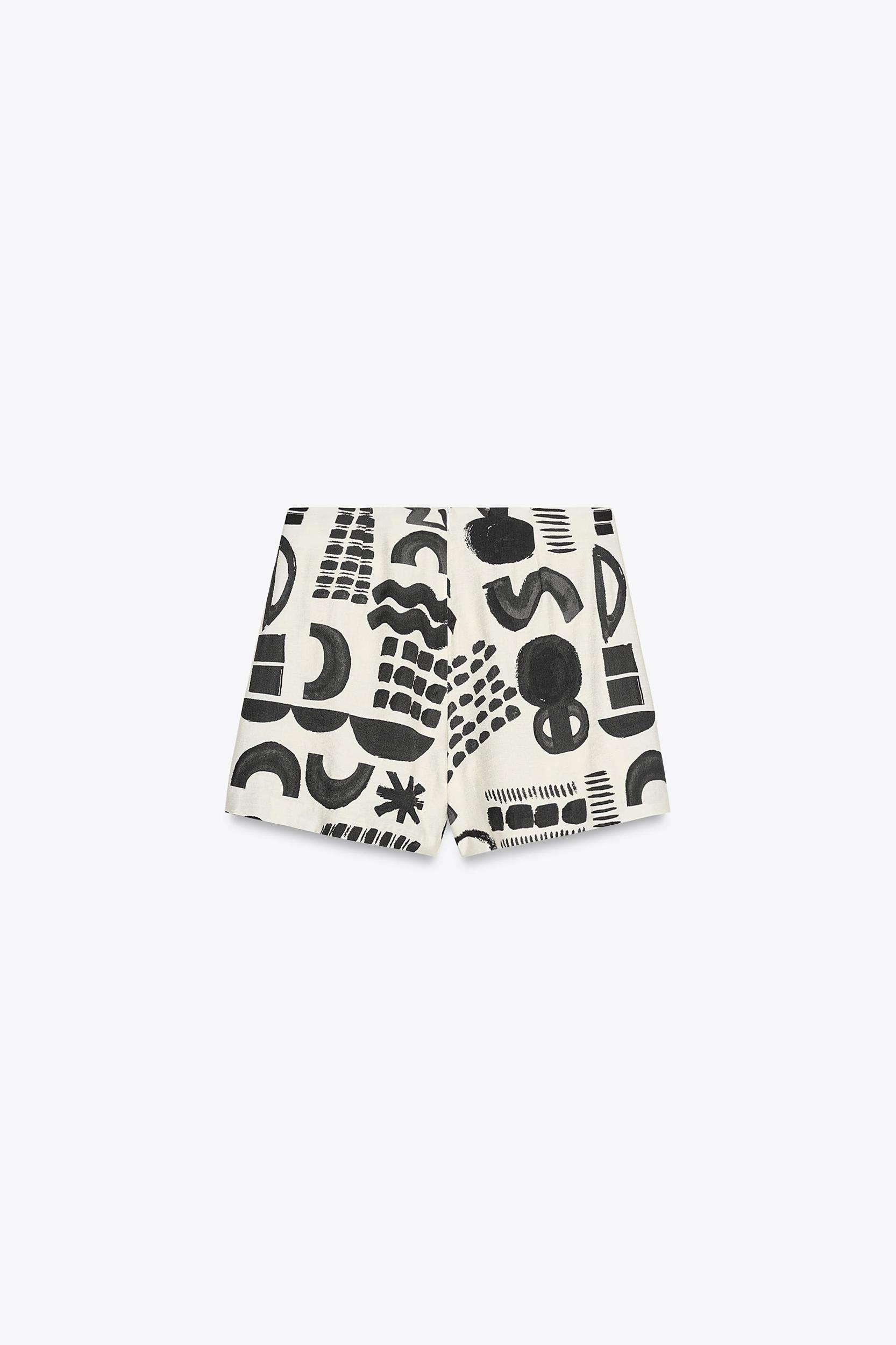 PRINTED BUCKLE MINI SKIRT Product Image