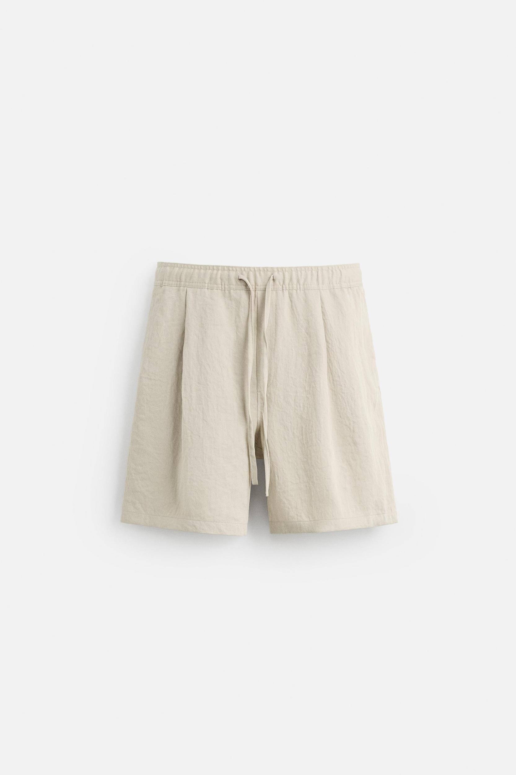 PLEATED FLOWY SHORTS Product Image