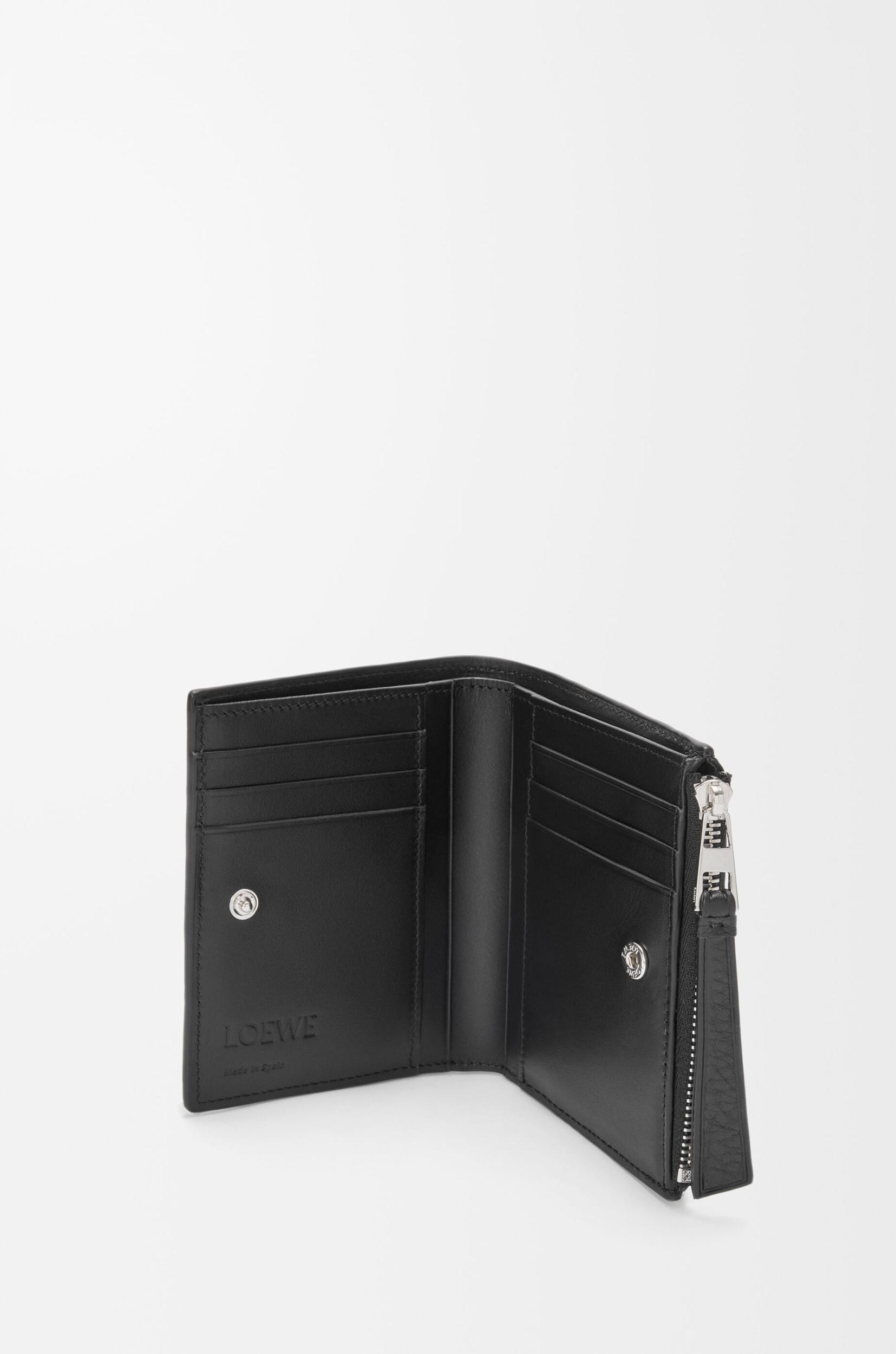 Puzzle slim compact wallet in supple grained calfskin Product Image