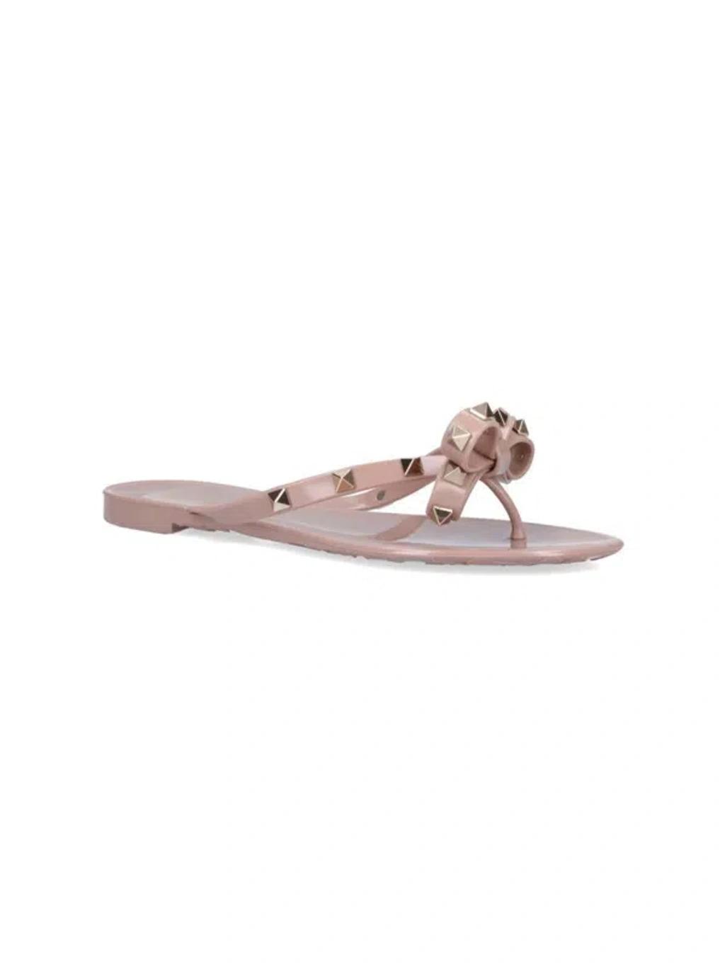 VALENTINO GARAVANI Women Rockstud Rubber Flip Flops In Beige Product Image