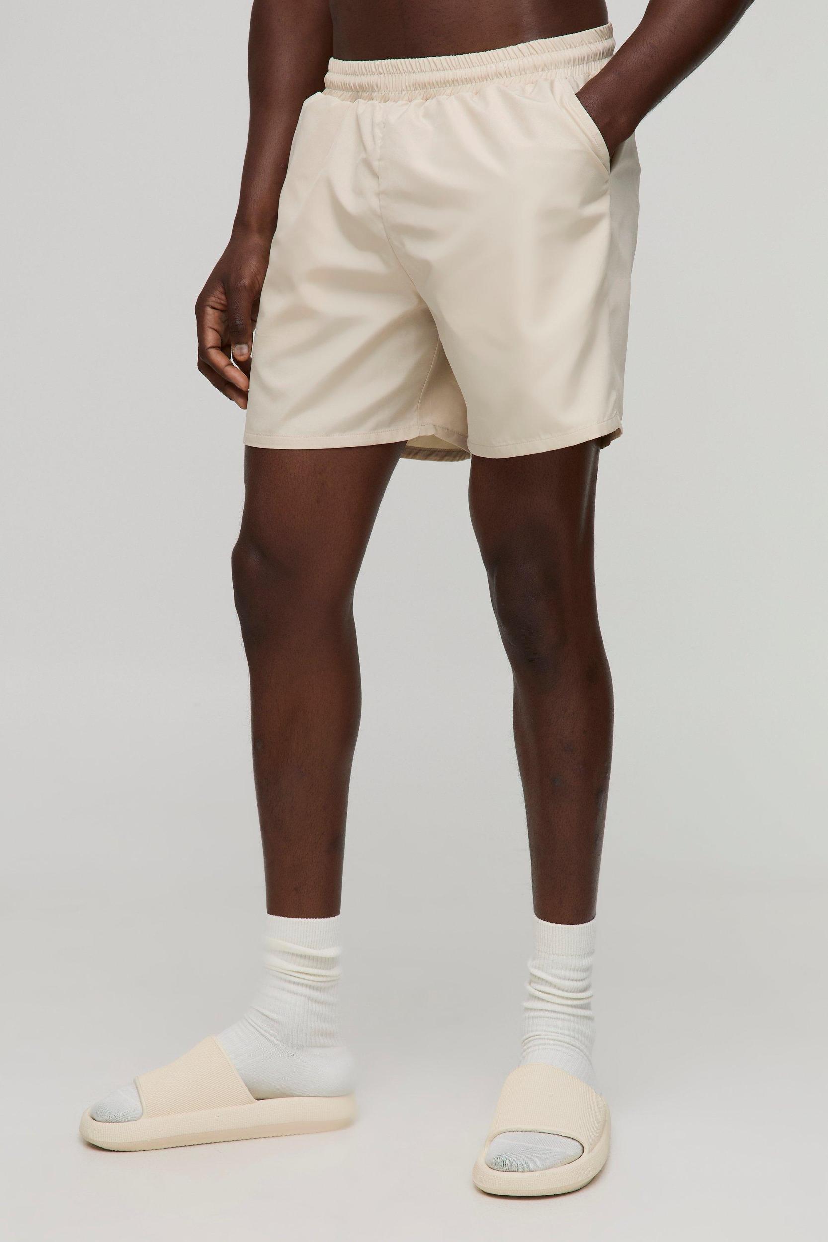 Regular fit Mid length Plain Swim Shorts | boohooMAN USA Product Image