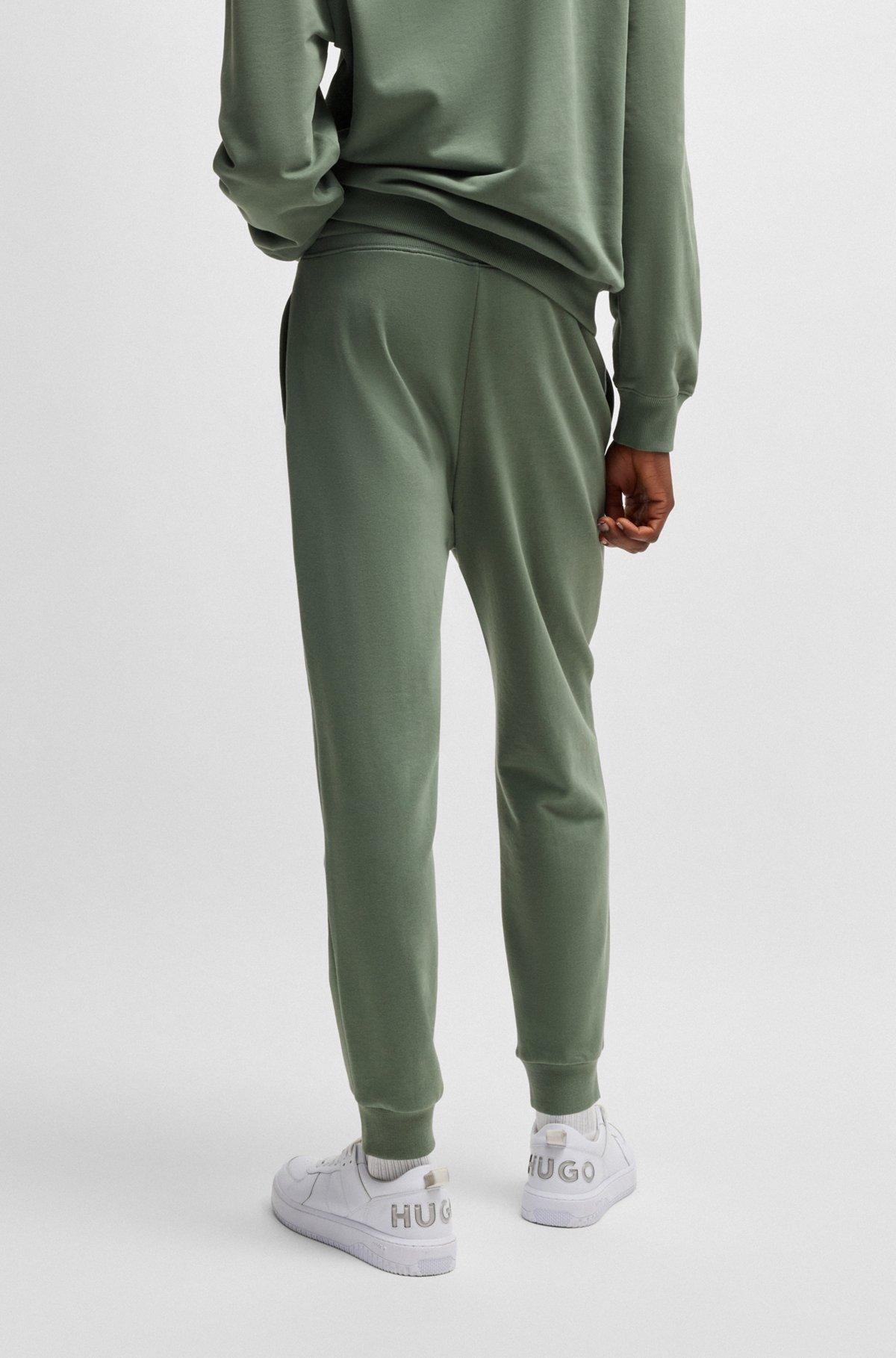 Cuffed tracksuit bottoms in cotton terry with logo print Product Image