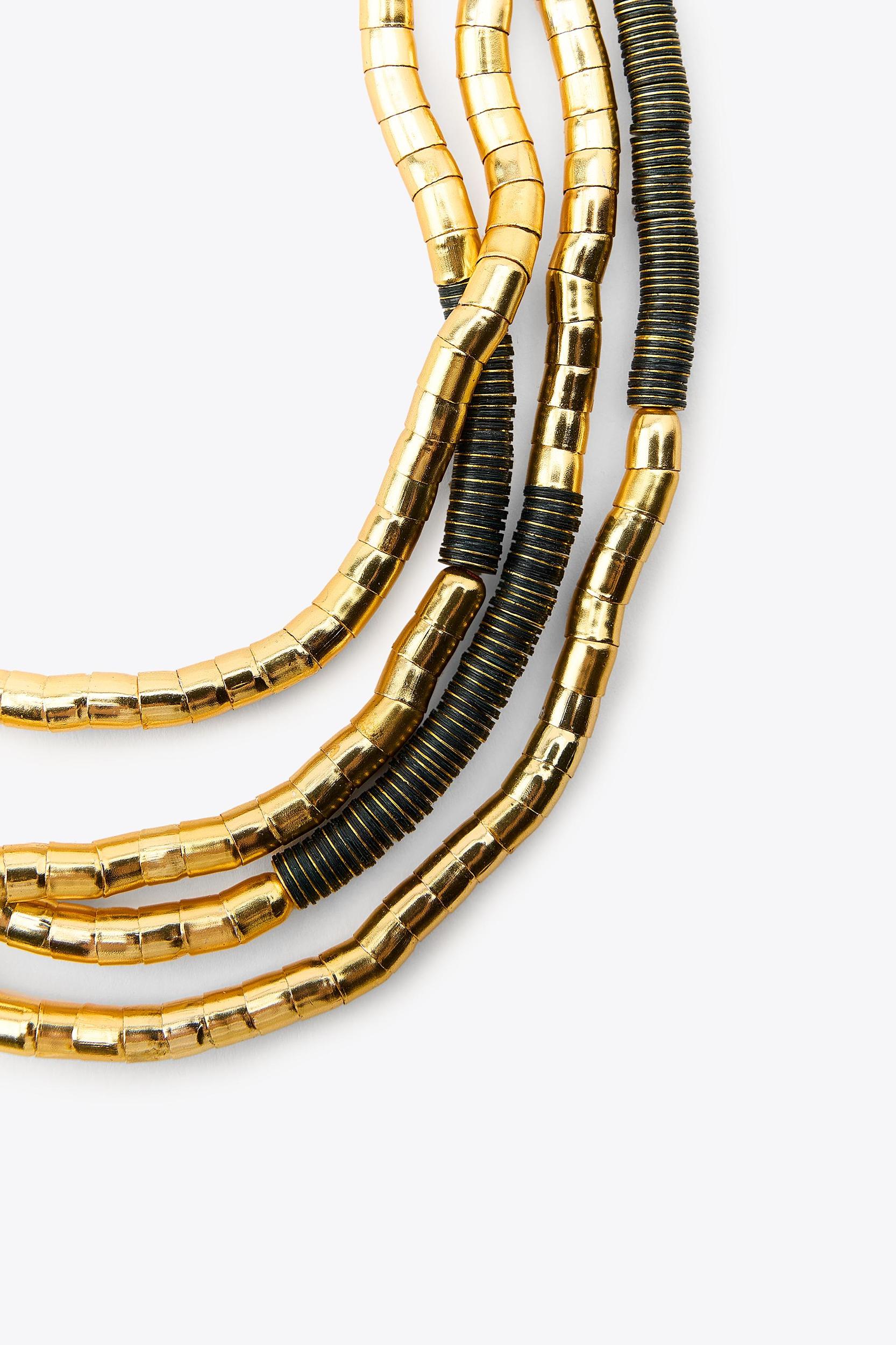 NECKLACE WITH MULTIPLE COMBINED PIECES Product Image
