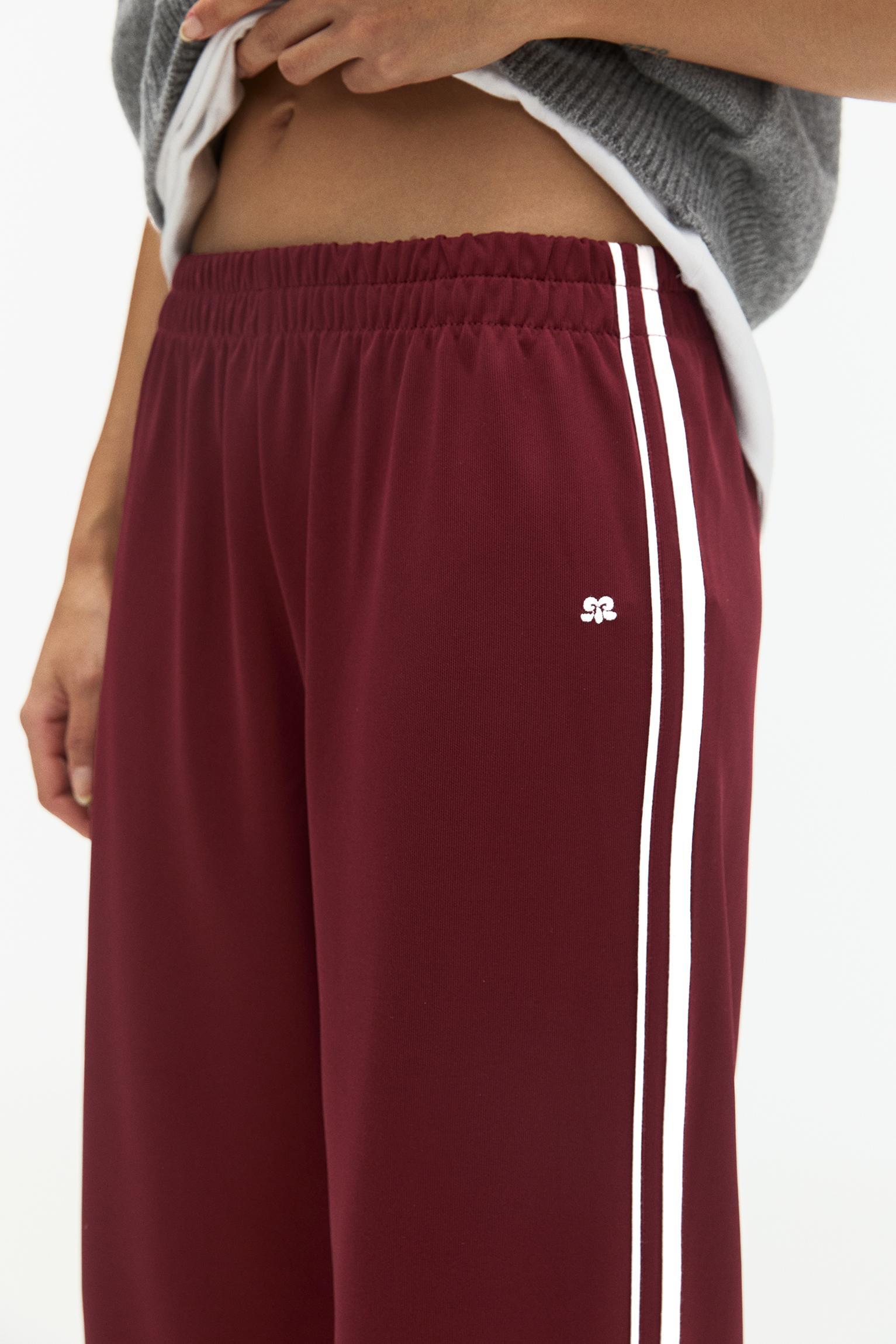 Tracksuit pants with side stripes Product Image