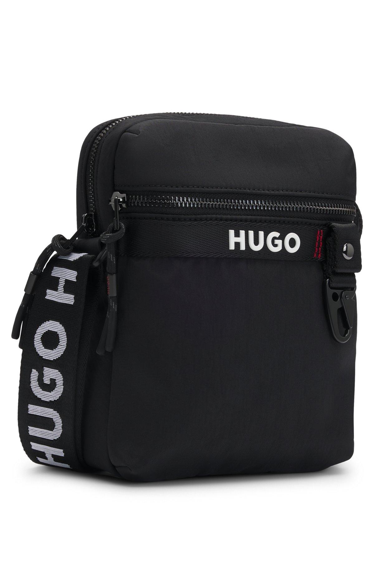 Reporter bag with branded adjustable strap and zip closure Product Image