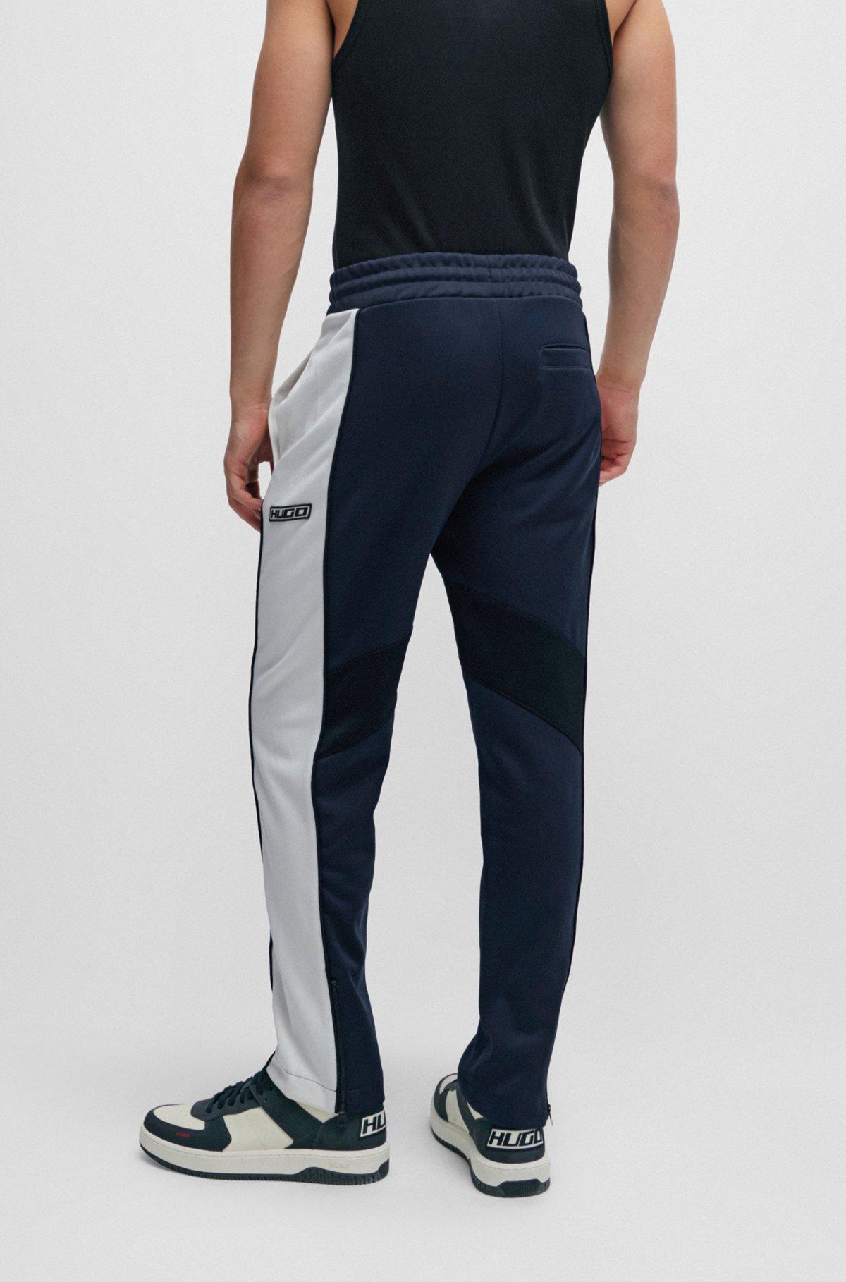 Relaxed-fit tracksuit bottoms with color-blocking Product Image