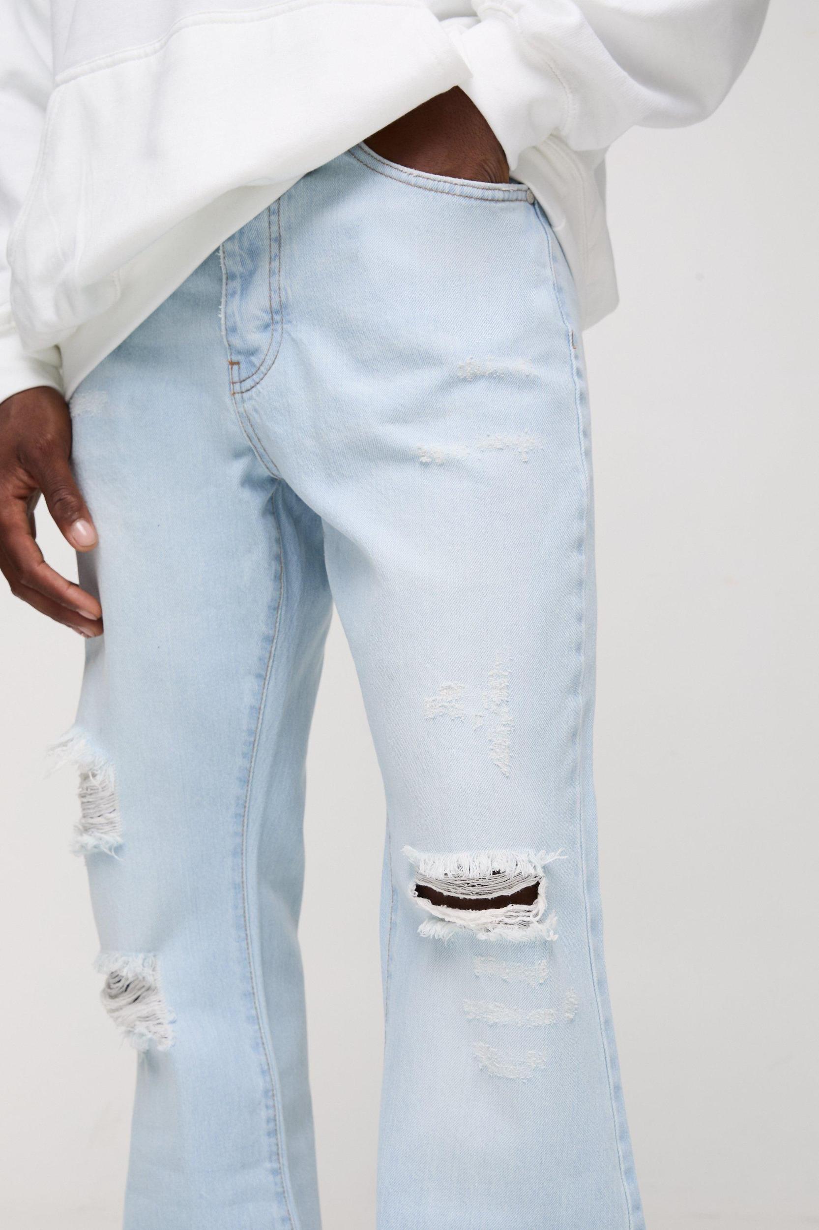 Relaxed Rigid Flare Stacked Knee Rip Denim Jeans | boohooMAN USA Product Image