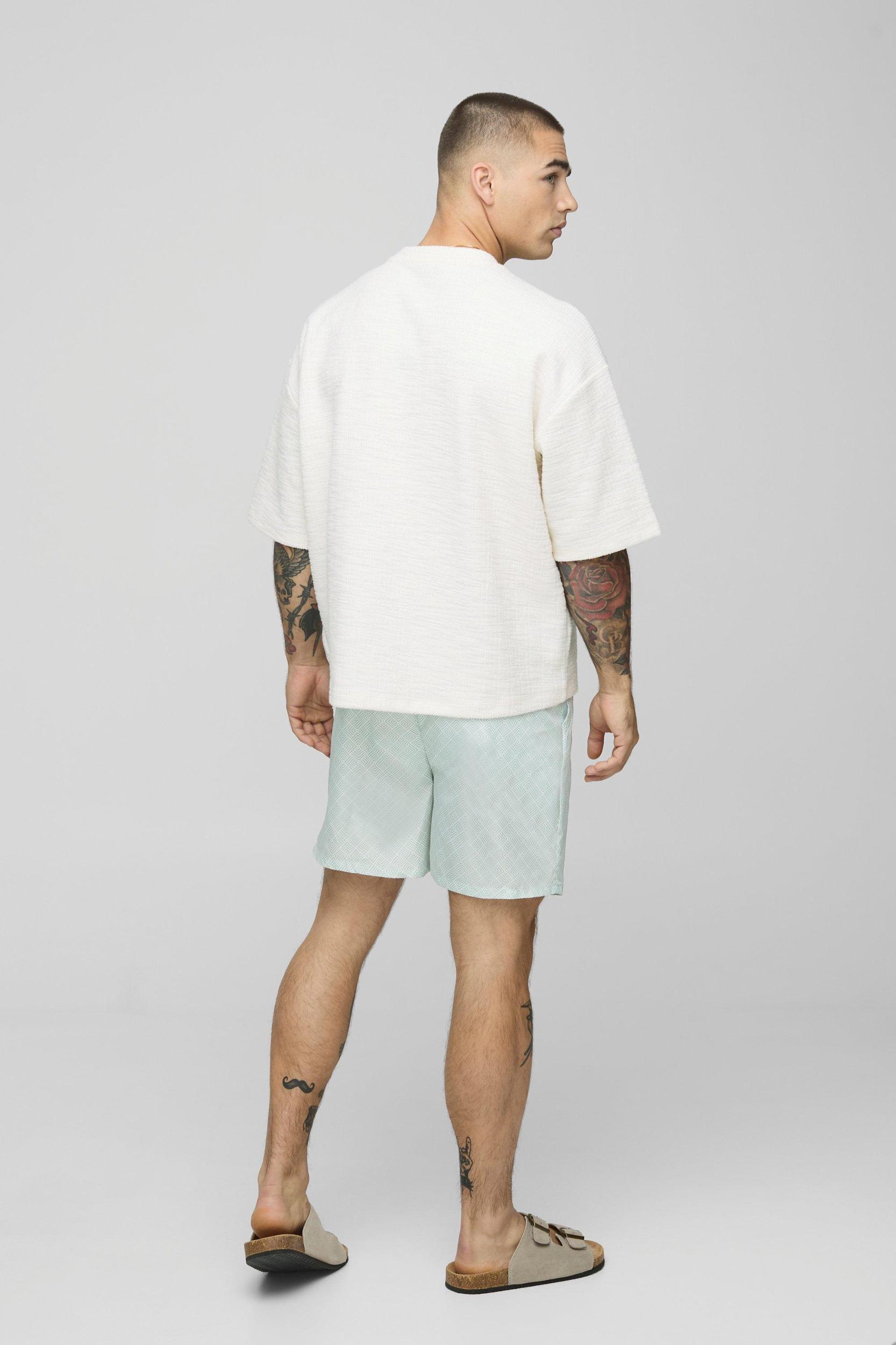 Geo Pattern Mid Length Swim Short | boohooMAN USA Product Image