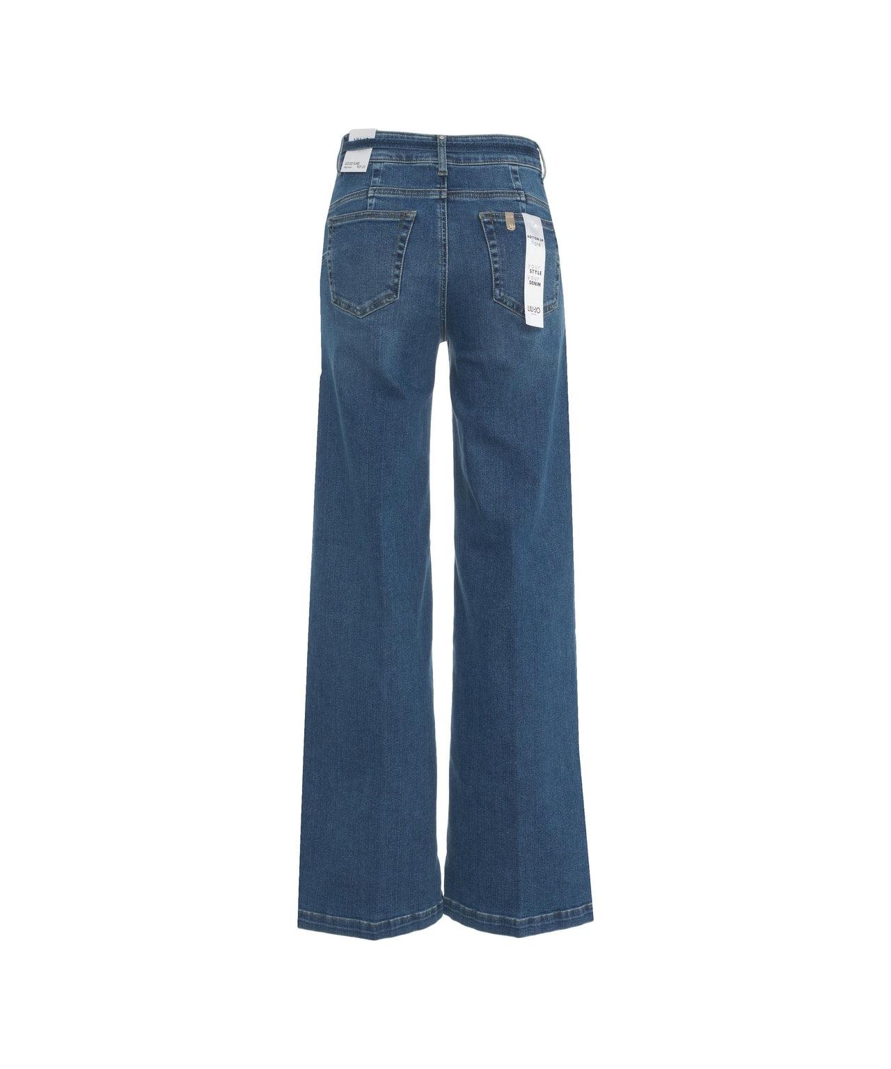 Flared jeans with belt Product Image