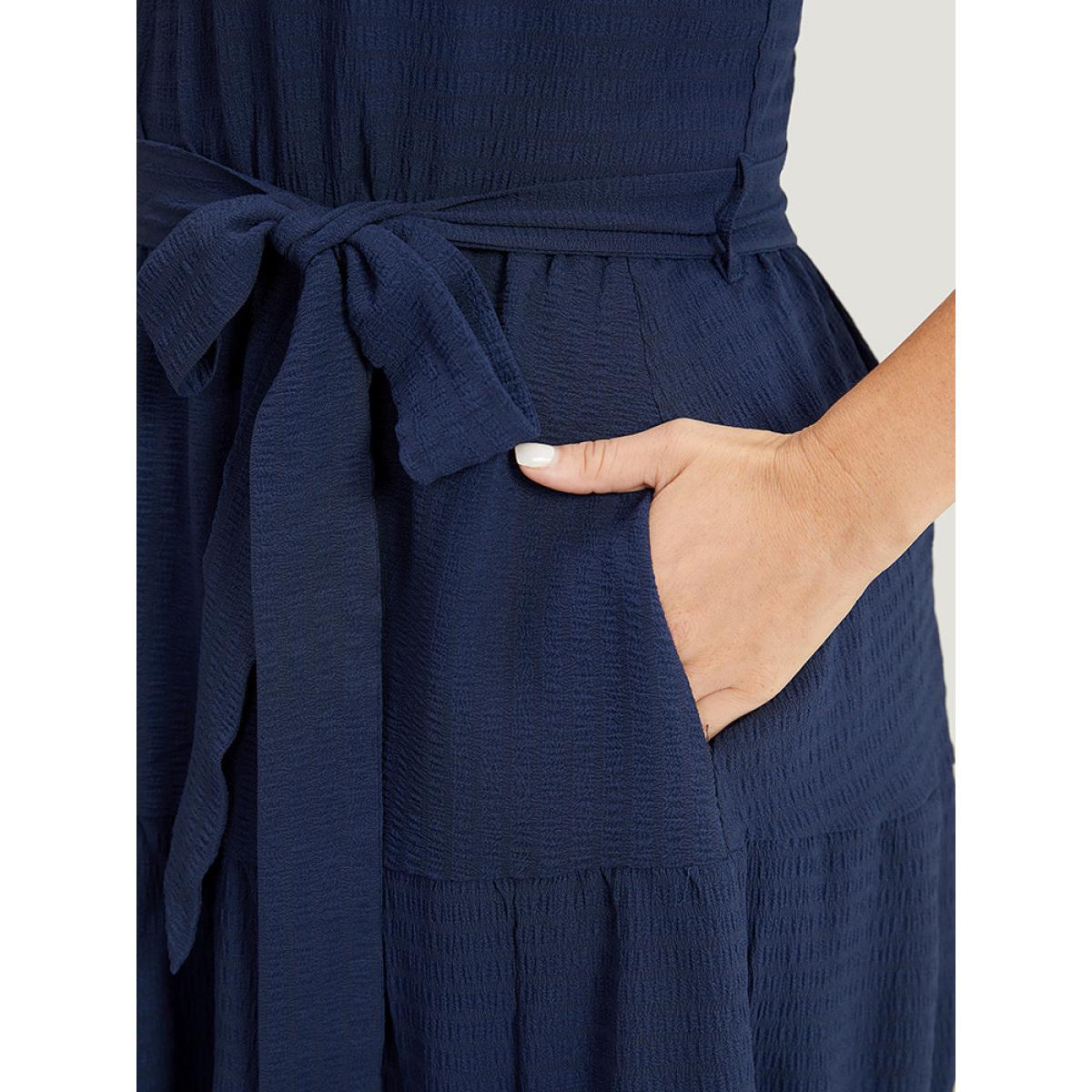 Plus Size Solid Knot Halter Pocket Belted Ruffles Tiered Hem Dress Indigo Women Elegant Gathered Halter neck Sleeveless Curvy Knee Dress BloomChic 12/L Product Image
