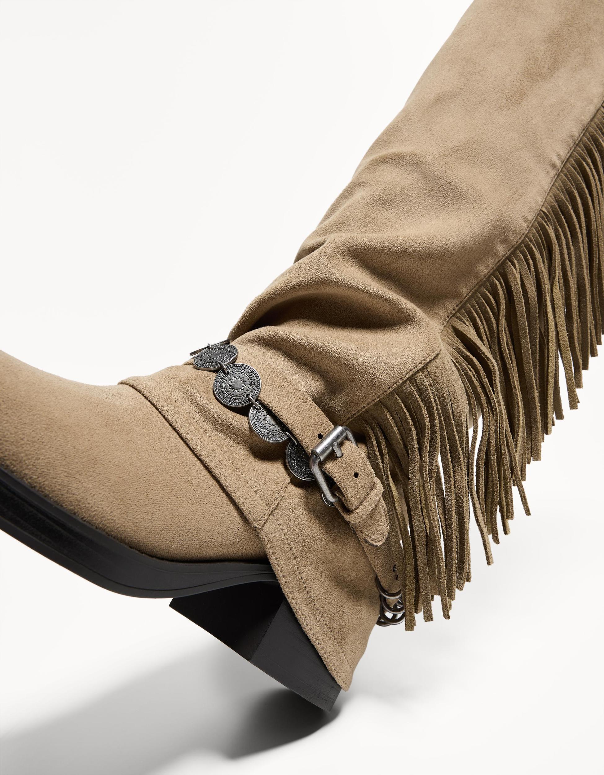 Flat boots with fringed pants Product Image