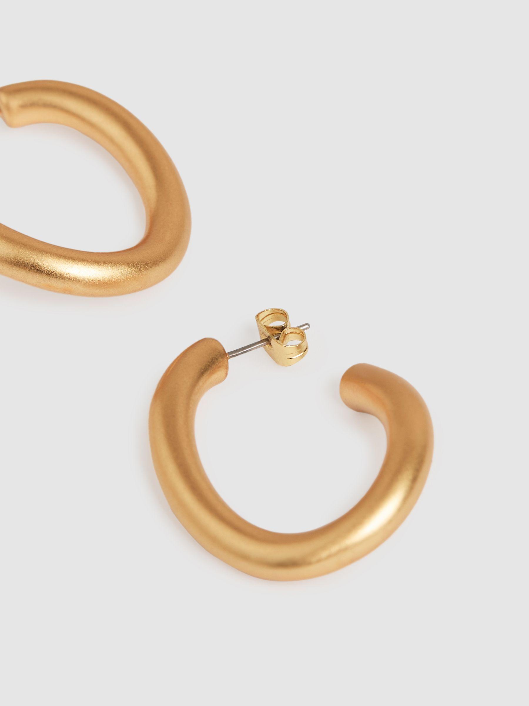 Wave Hoop Earrings in Gold Tone Product Image