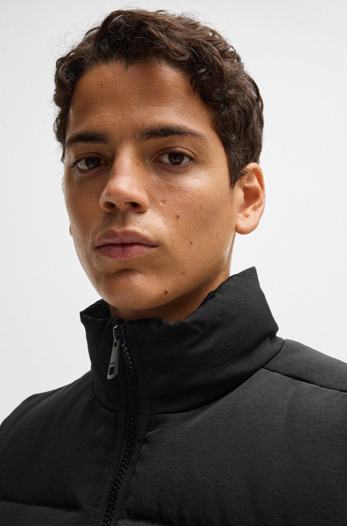 Water-repellent gilet with blue logo label Product Image