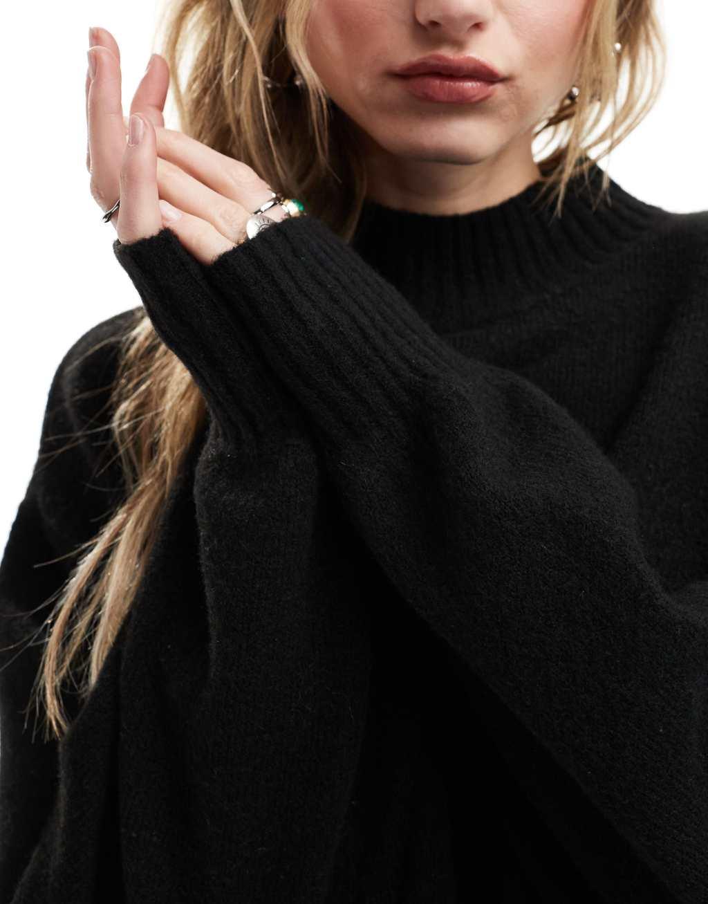 Monki knitted turtleneck sweater in black Product Image
