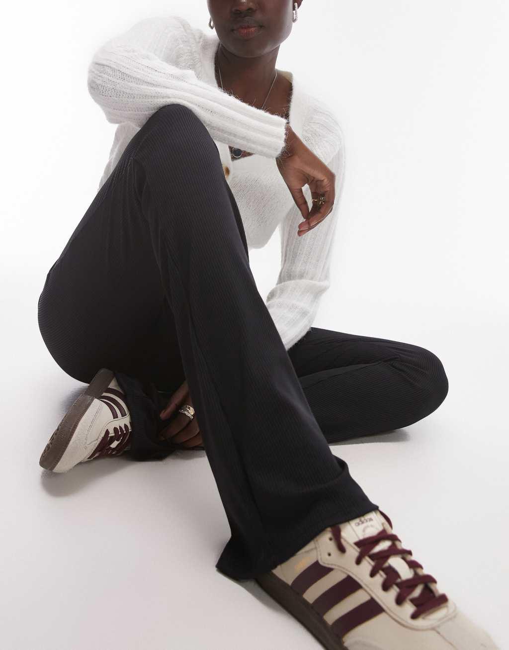 Topshop Tall skinny ribbed flared pants in black Product Image